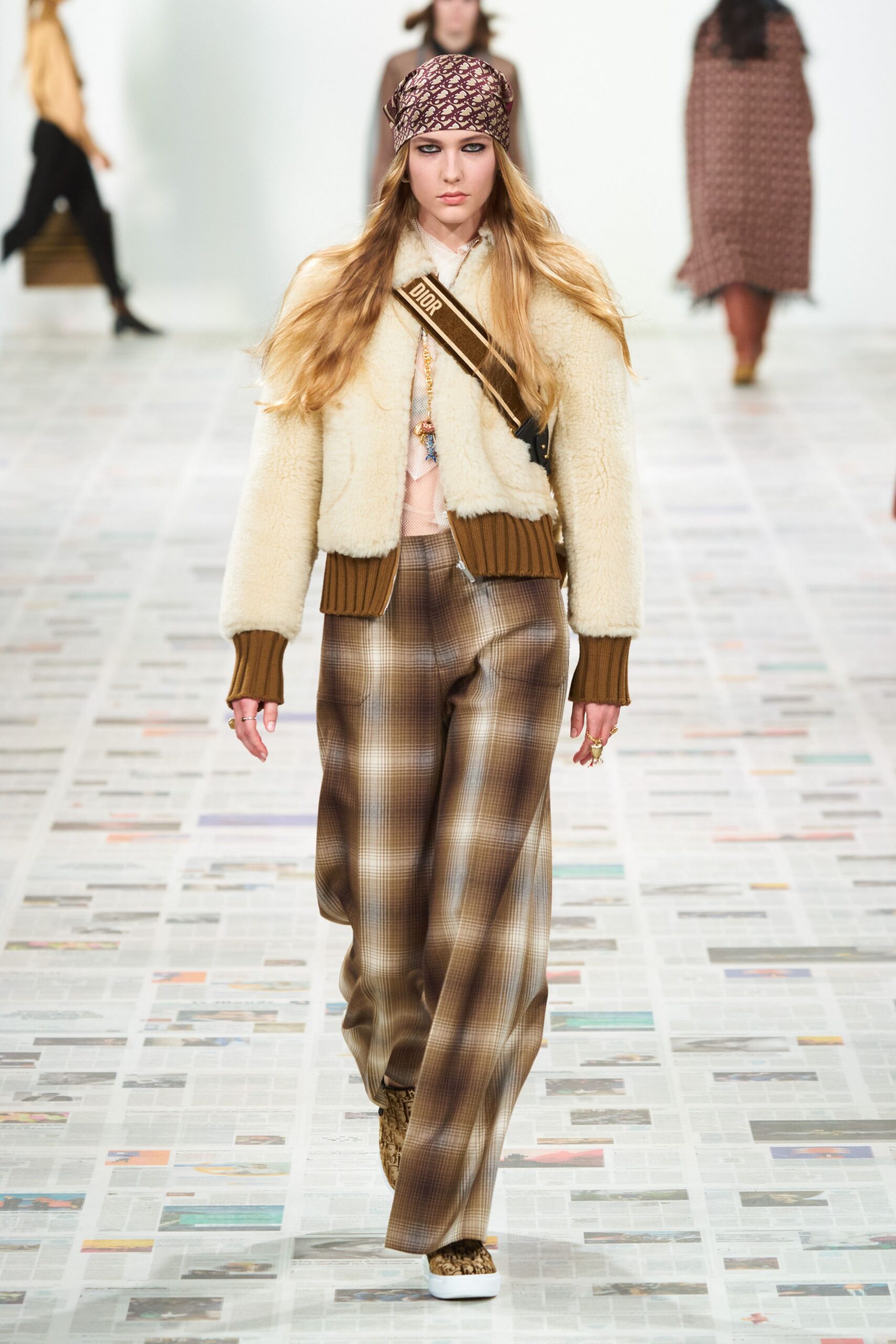 beige faux-fur jacket with plaid pants