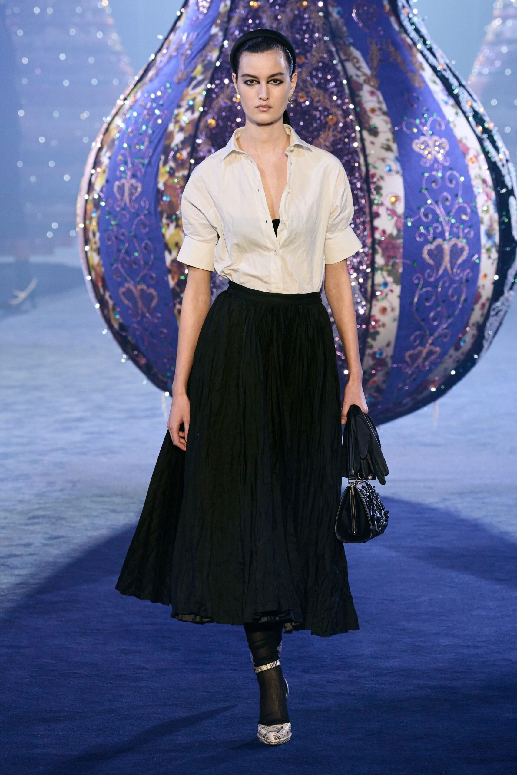 white shirt black pleated skirt