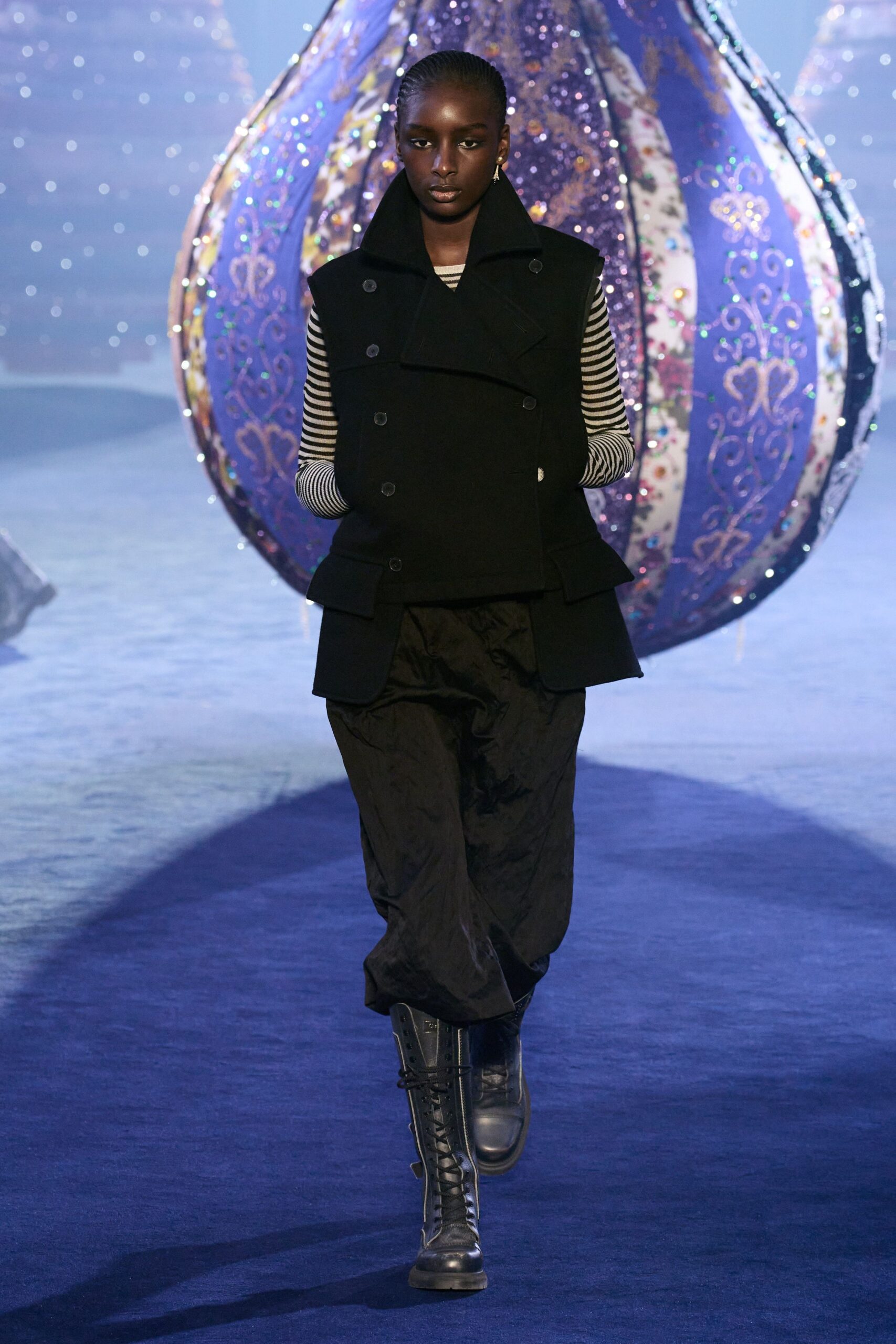 black fitted vest with relaxed pants