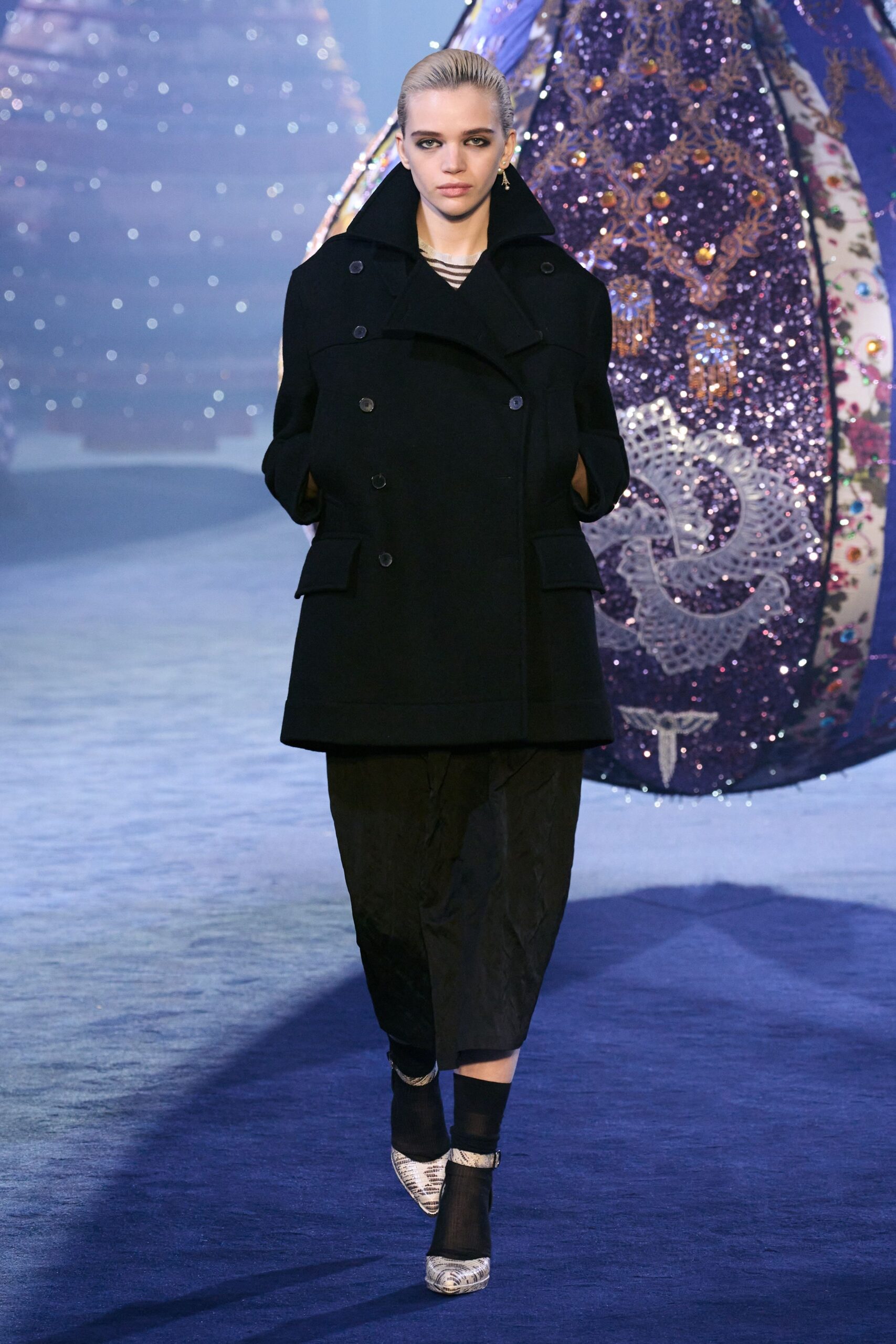 black wool coat with relaxed pants