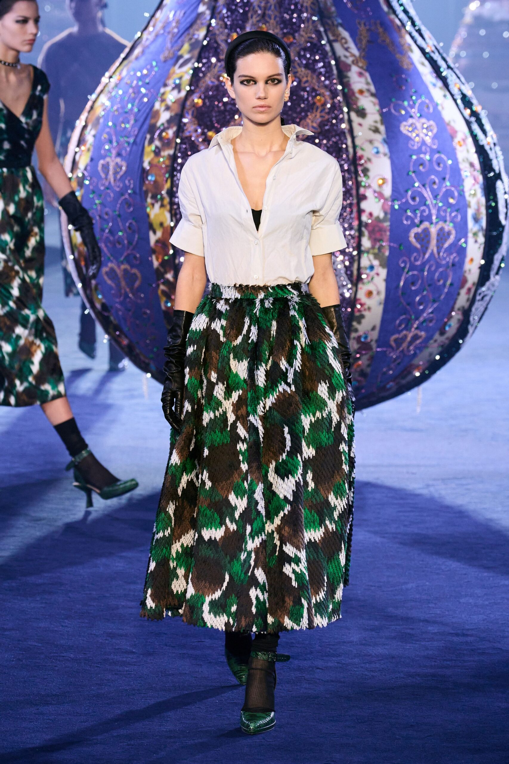 white shirt green brown pleated skirt