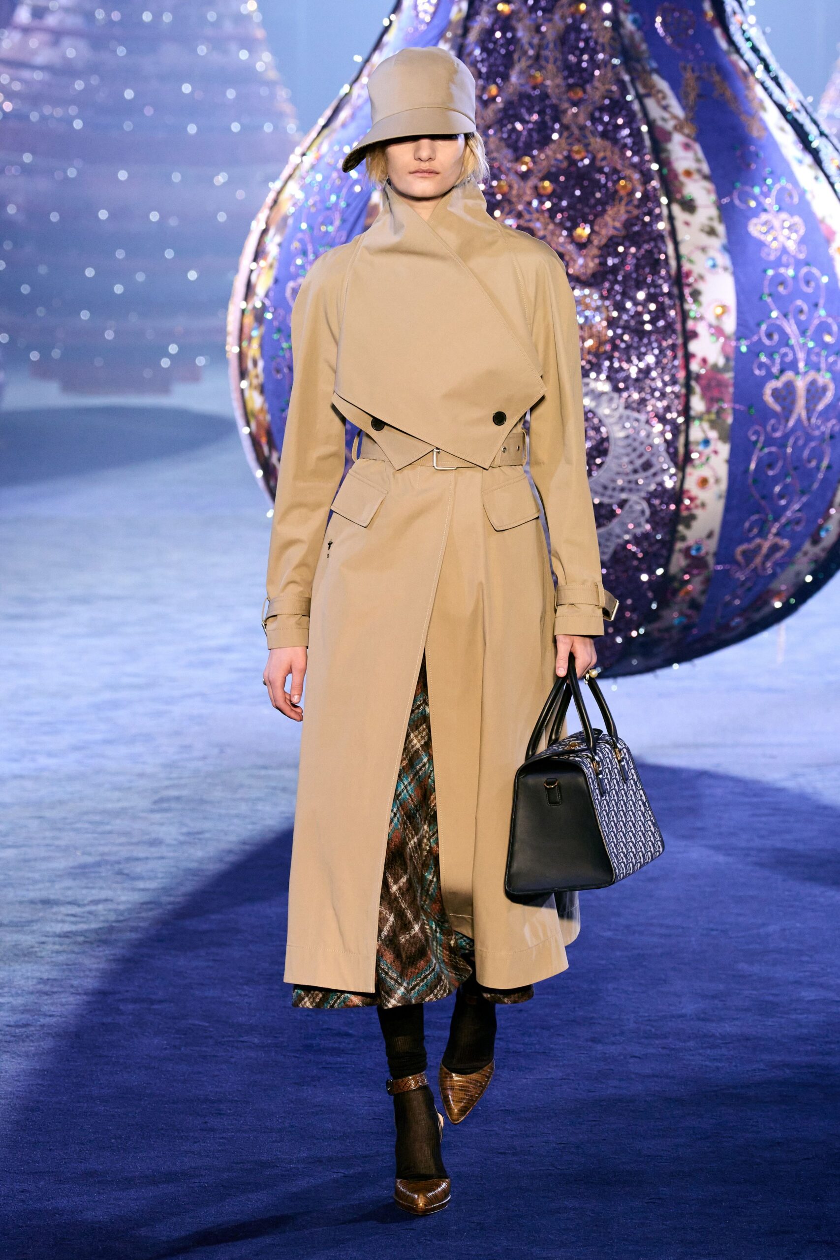 beige trench coat with pleated skirt