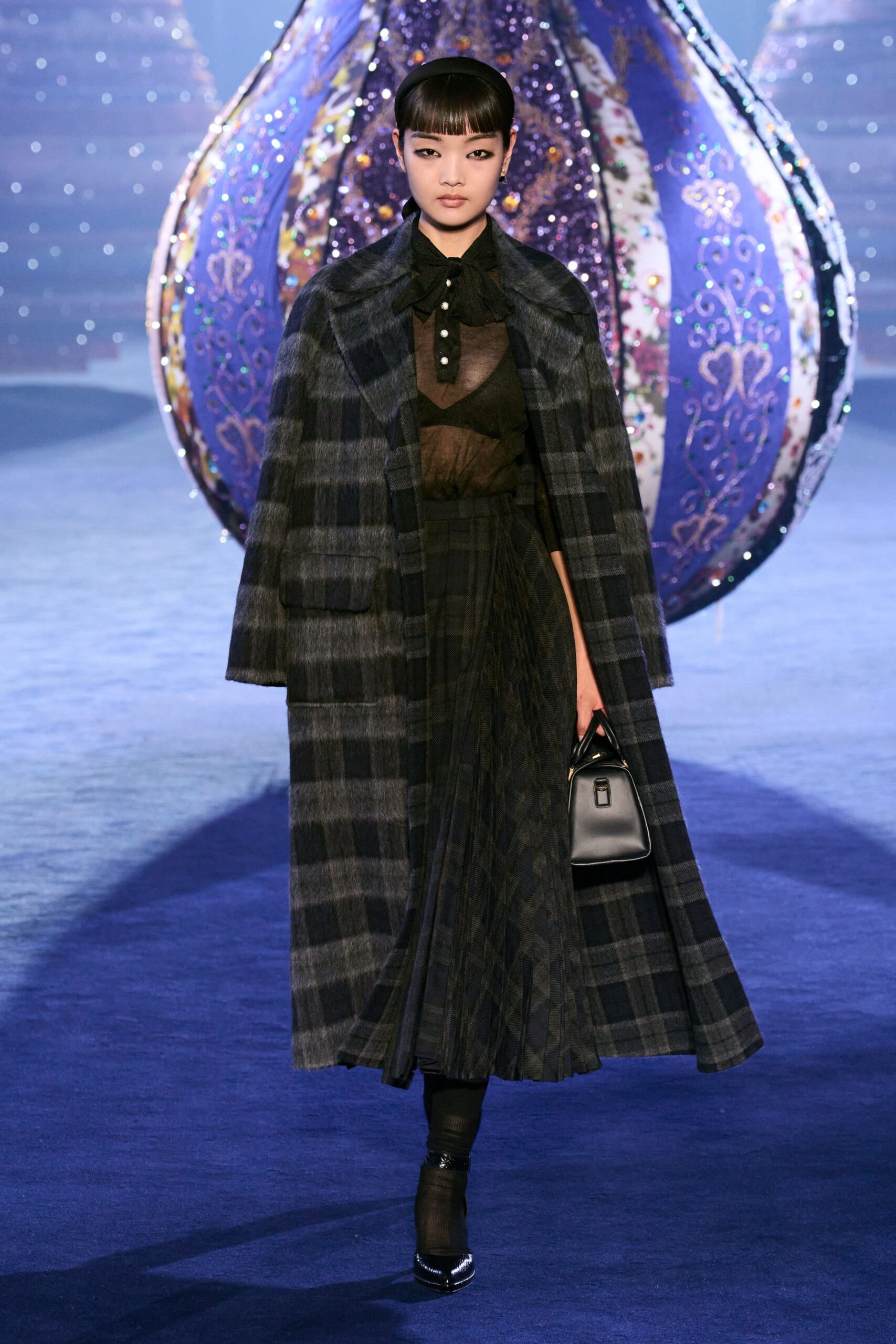 black wool coat with pleated skirt
