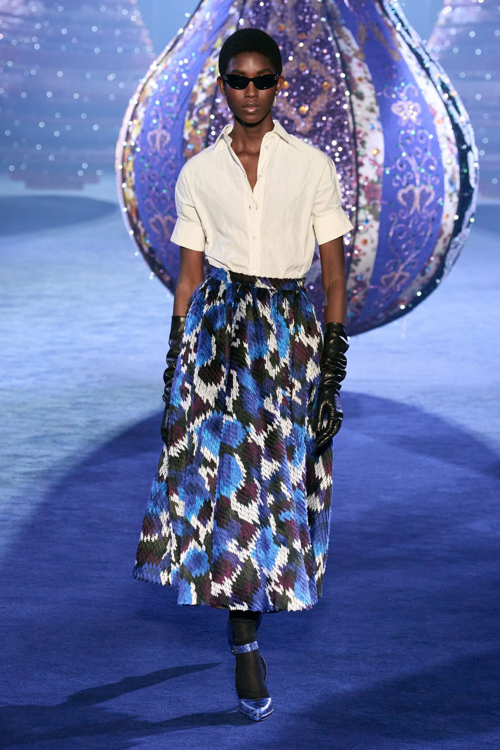 white shirt blue pleated skirt
