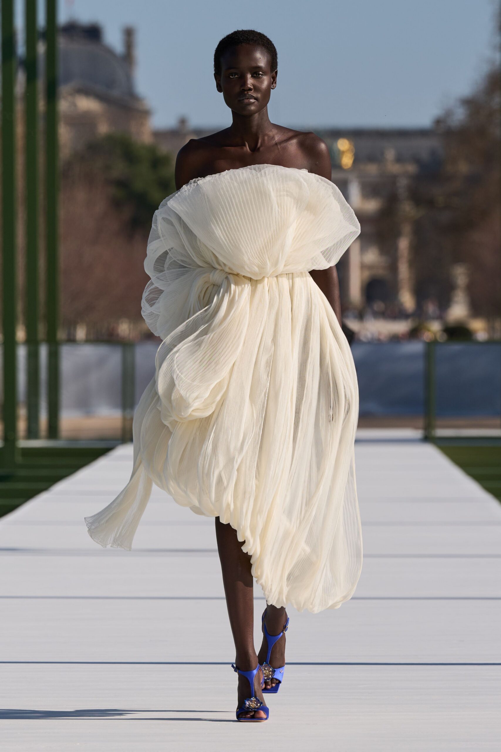 white chiffon sleeveless off-shoulder relaxed pleated draped gown