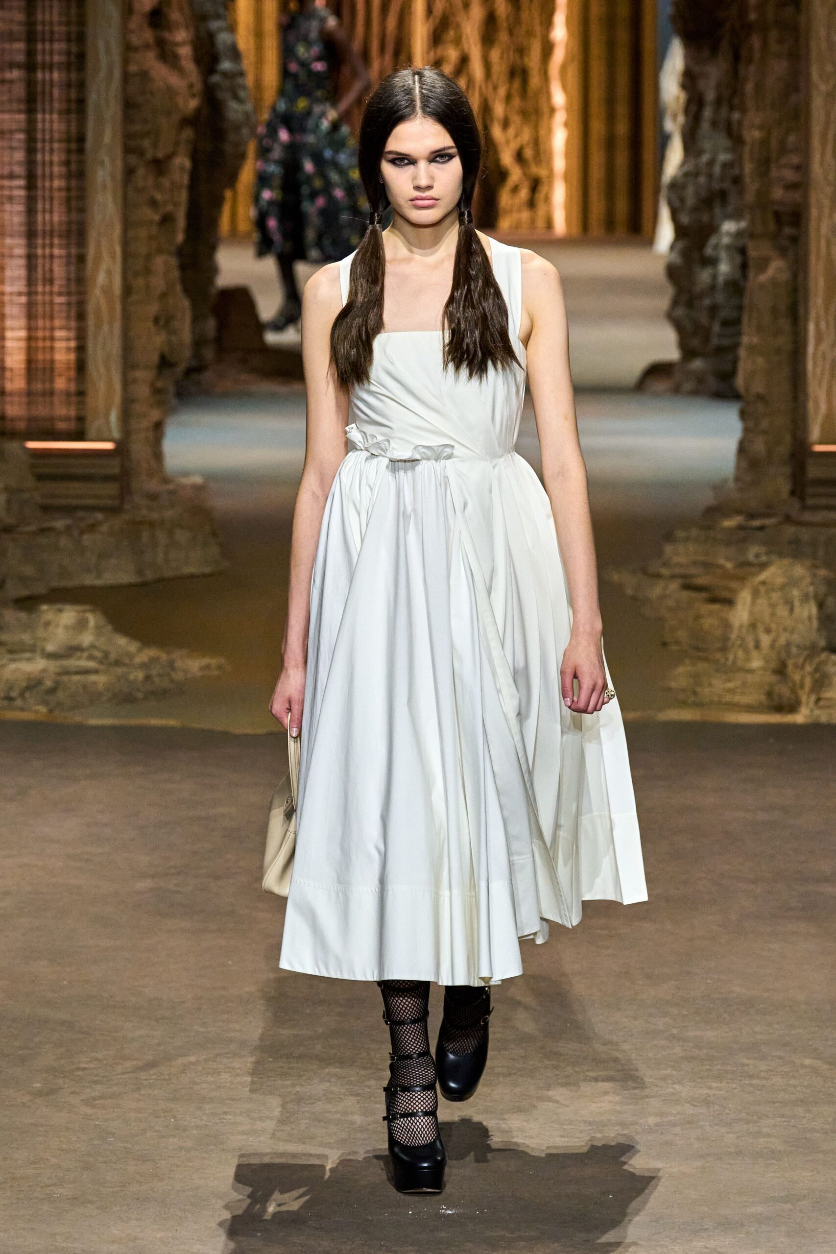 white cotton sleeveless v-neck fitted pleated belted dress