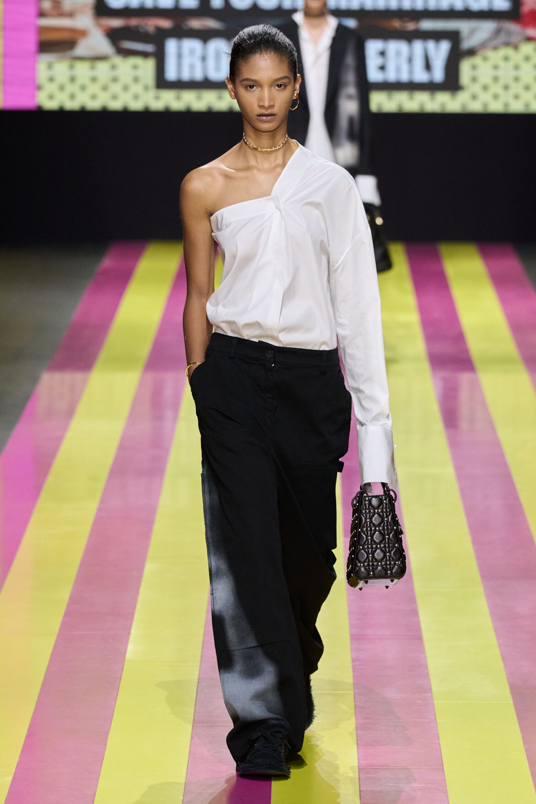 white off-shoulder shirt with black cargo pants
