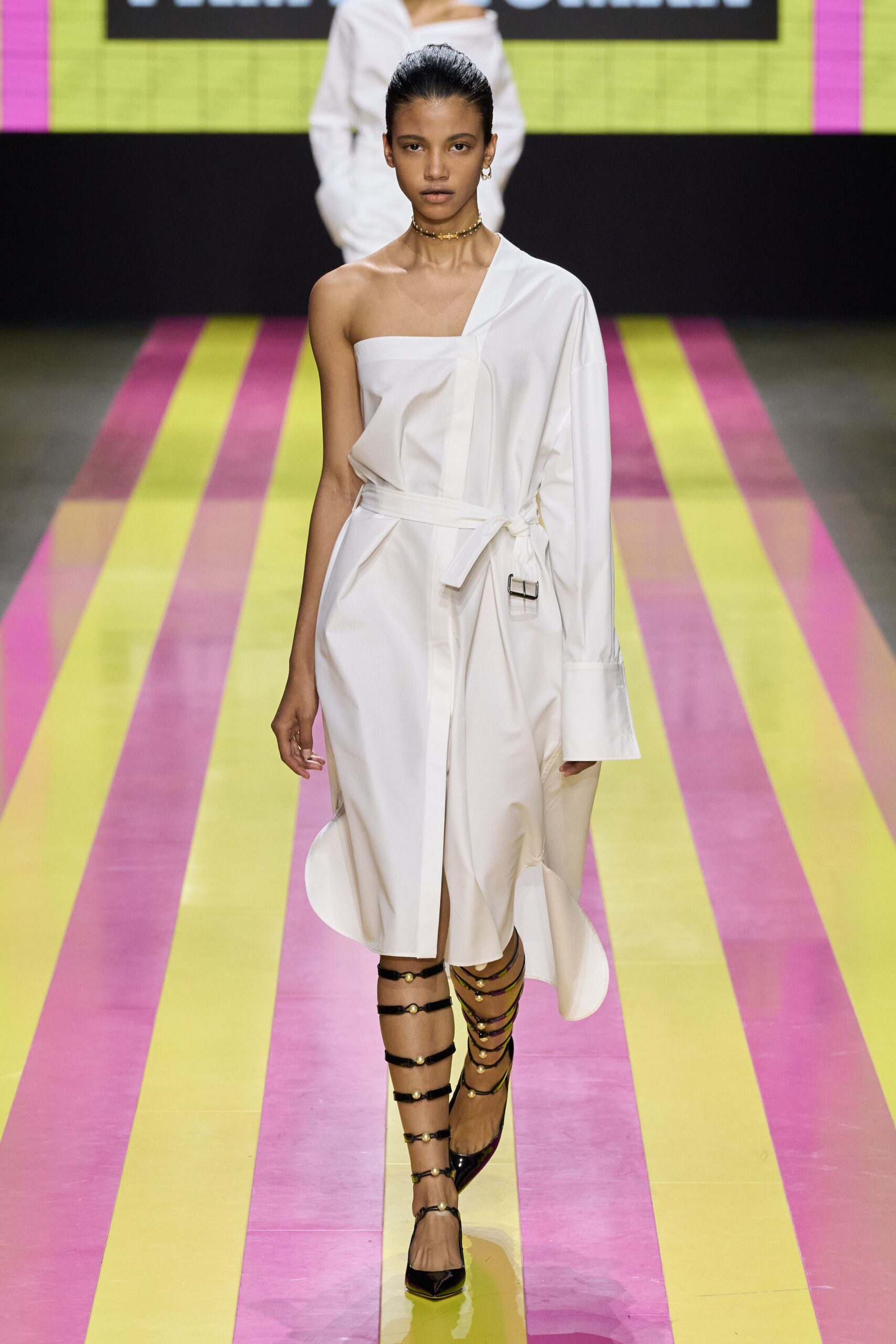 white shirt-dress with black strappy shoes