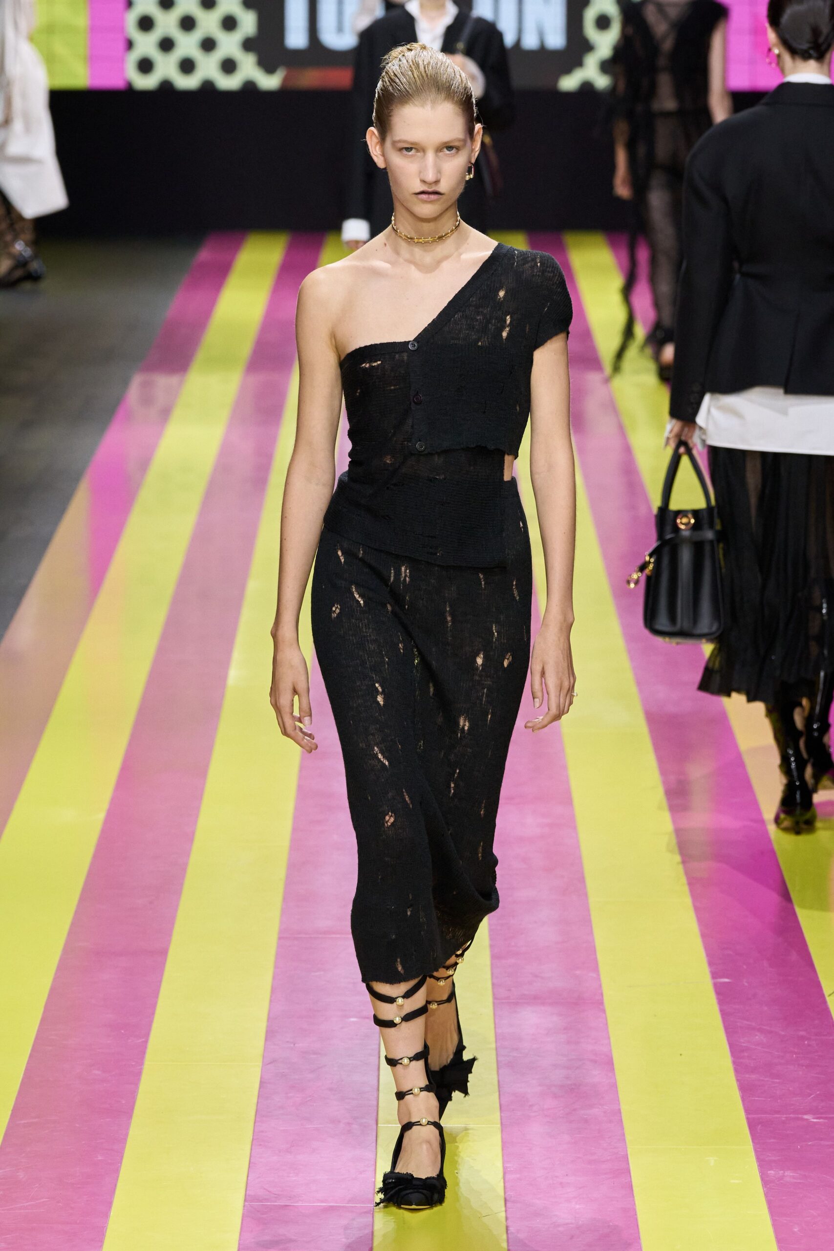 black fitted midi dress with strappy shoes