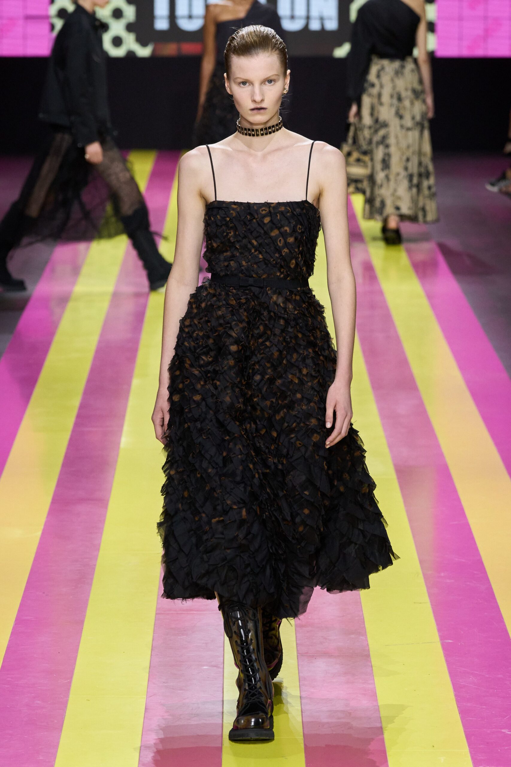 black tiered ruffled midi dress with boots