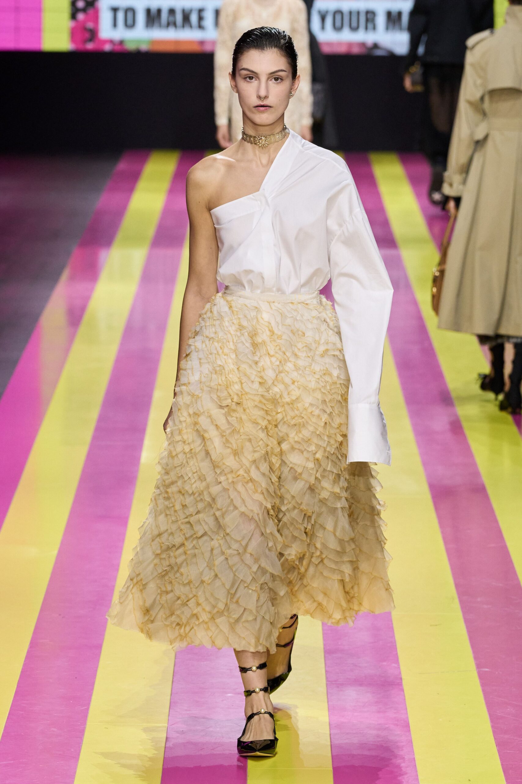 white off-shoulder shirt with beige ruffled skirt