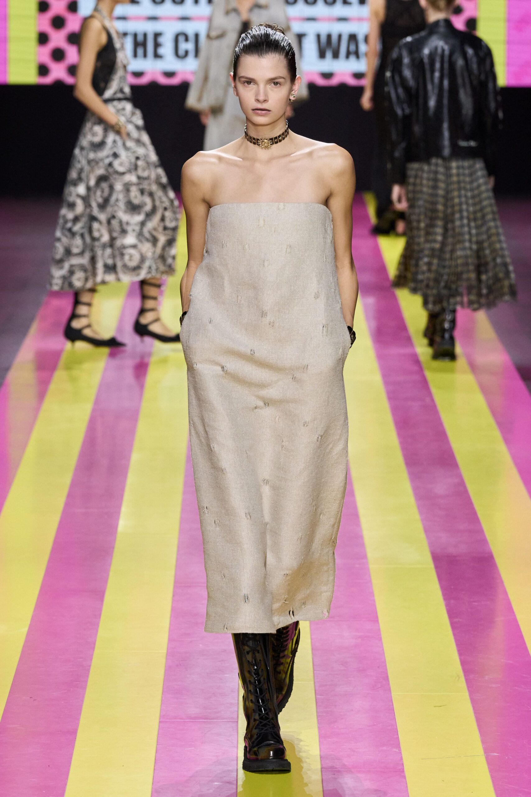 beige strapless midi dress with black boots