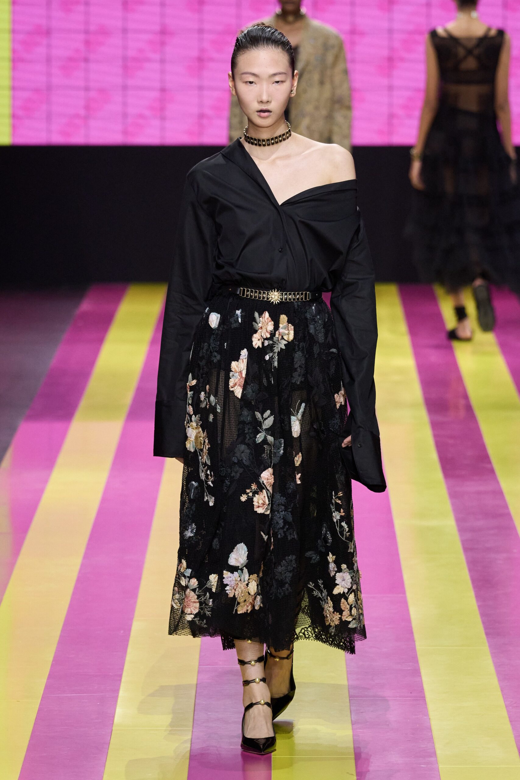 black off-shoulder shirt and floral skirt