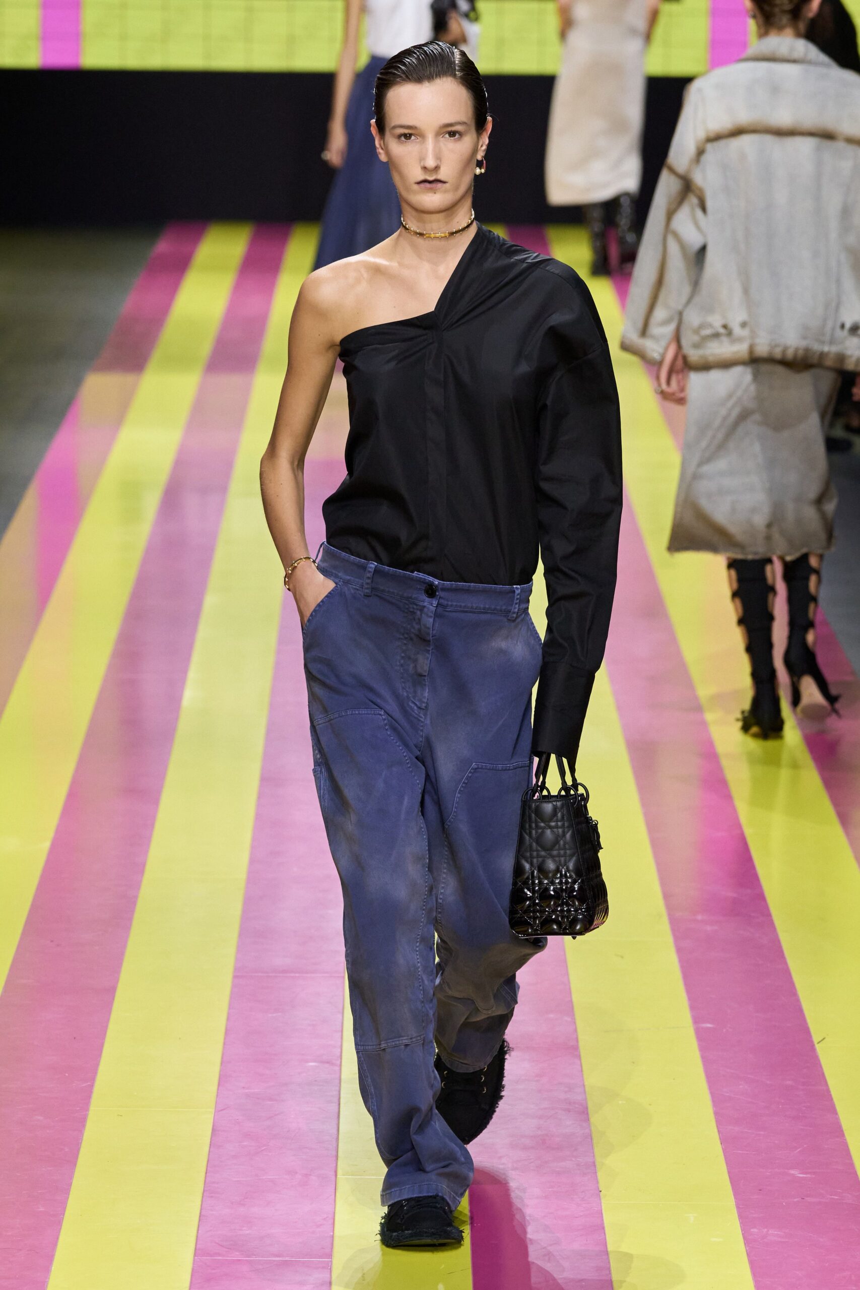 black asymmetric shirt blue cargo pants