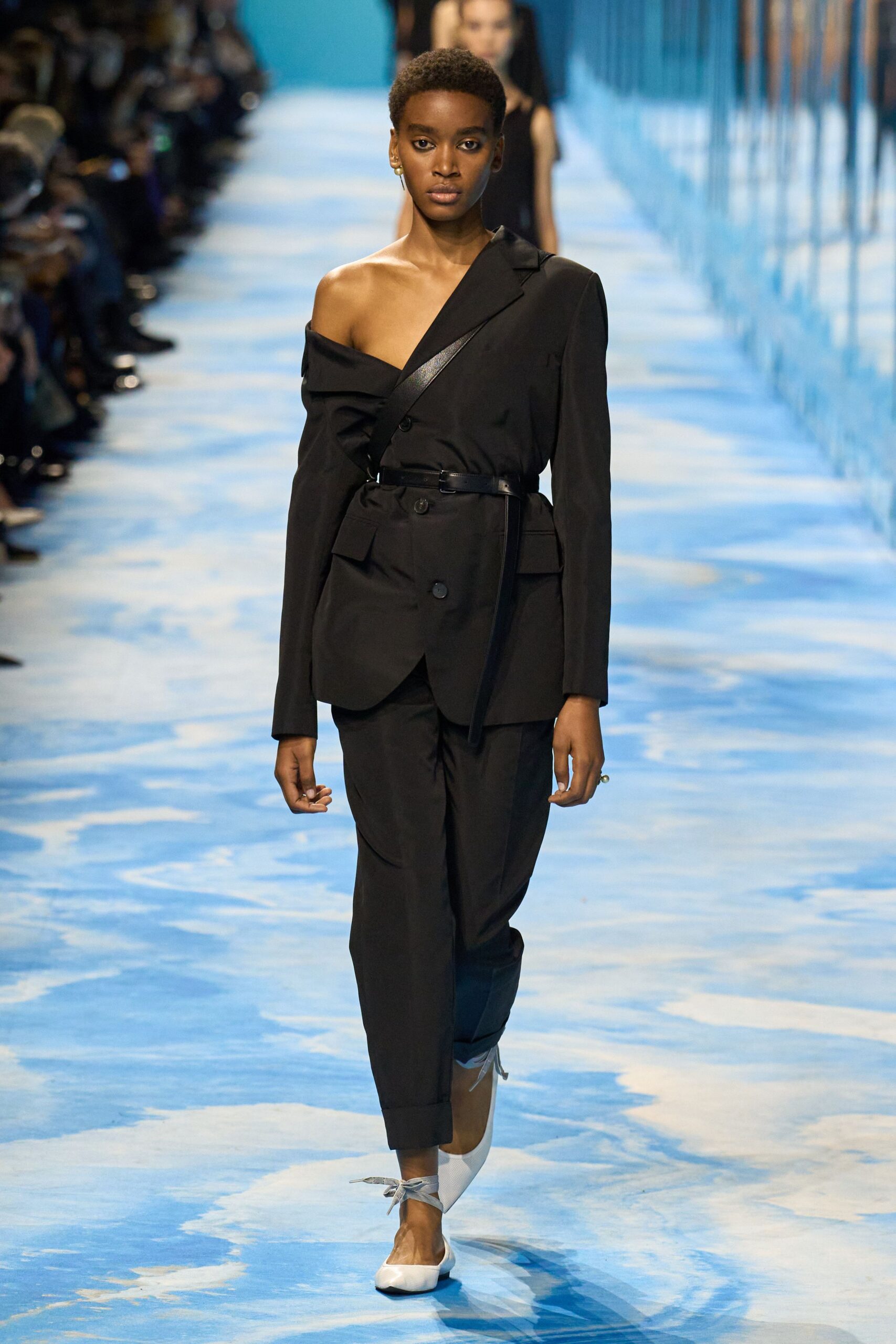 black tailored suit with white shoes