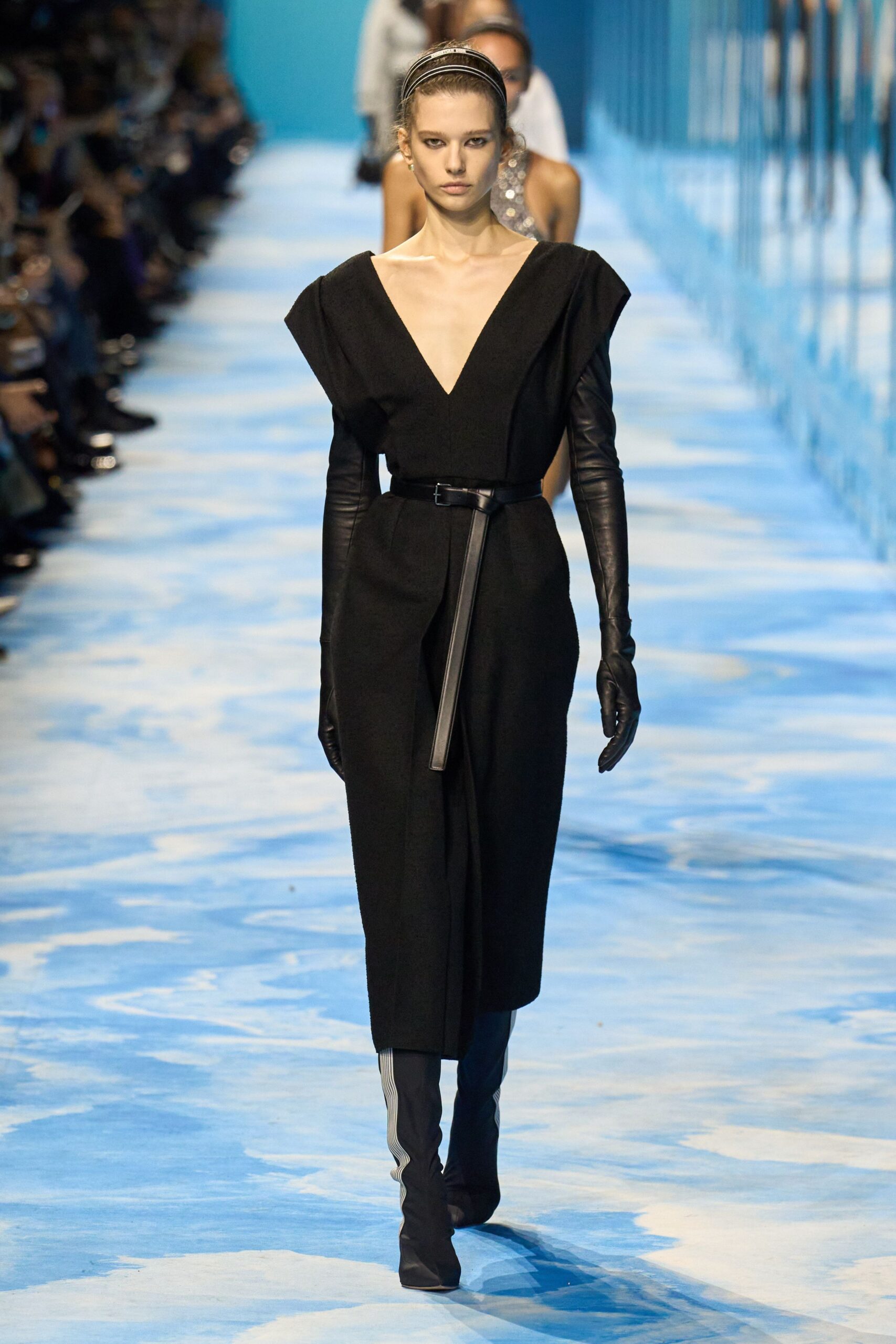 black fitted midi dress with gloves and boots