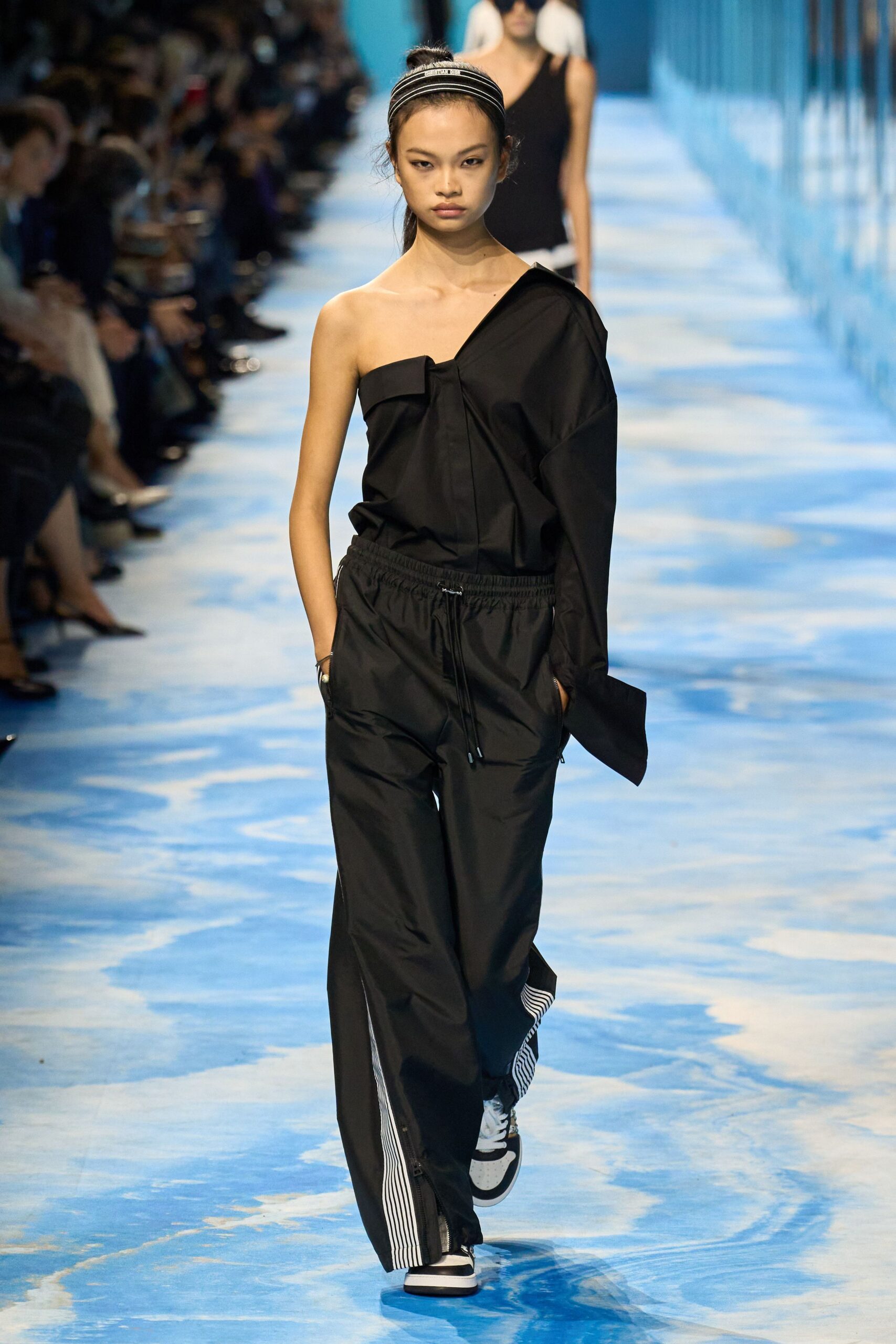 black asymmetric top with relaxed pants