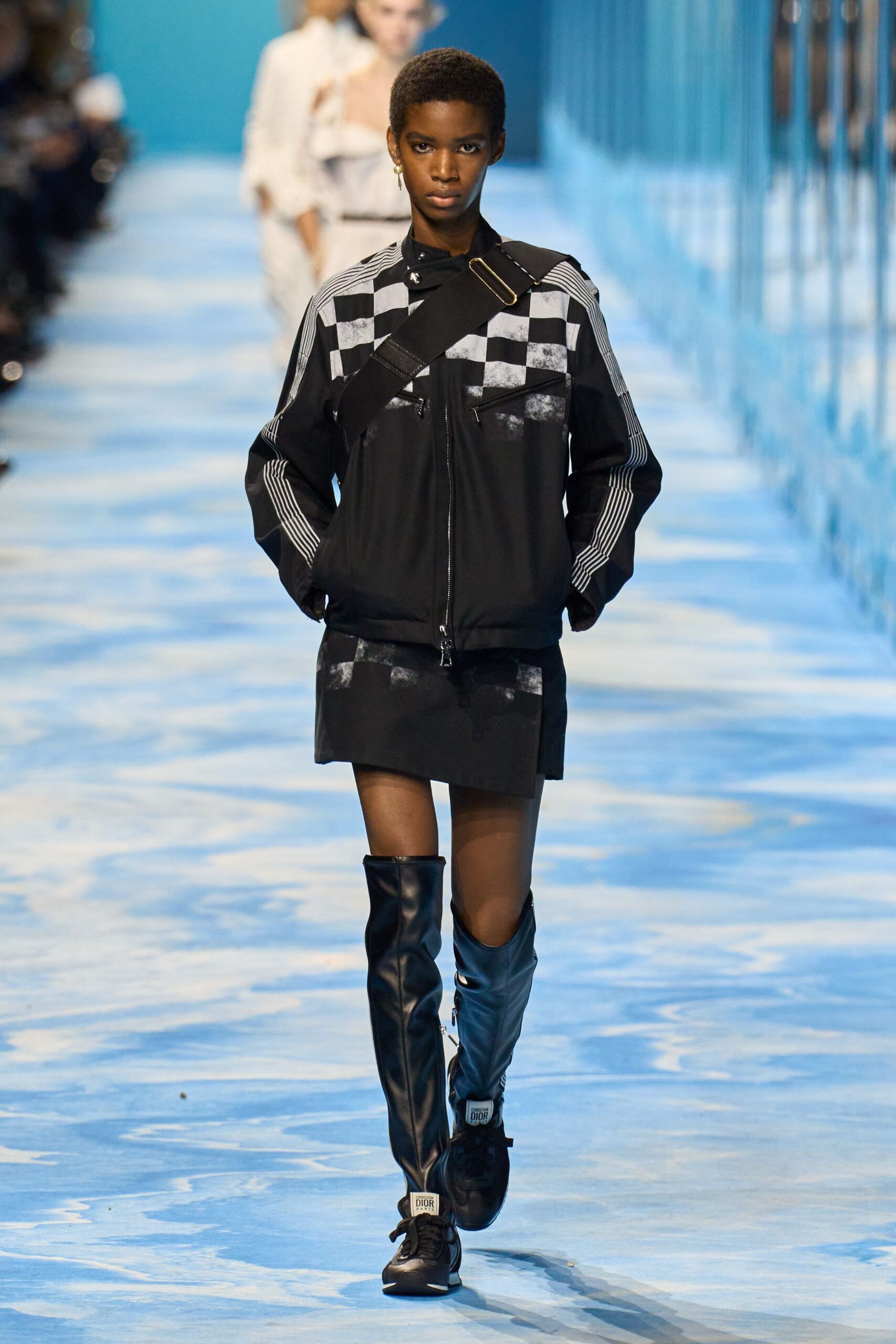 black fitted jacket and mini skirt