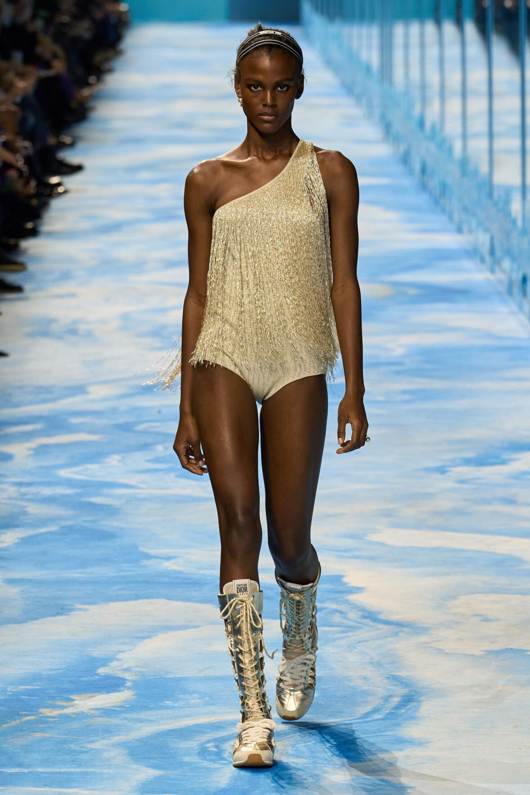 gold fringed bodysuit with silver boots