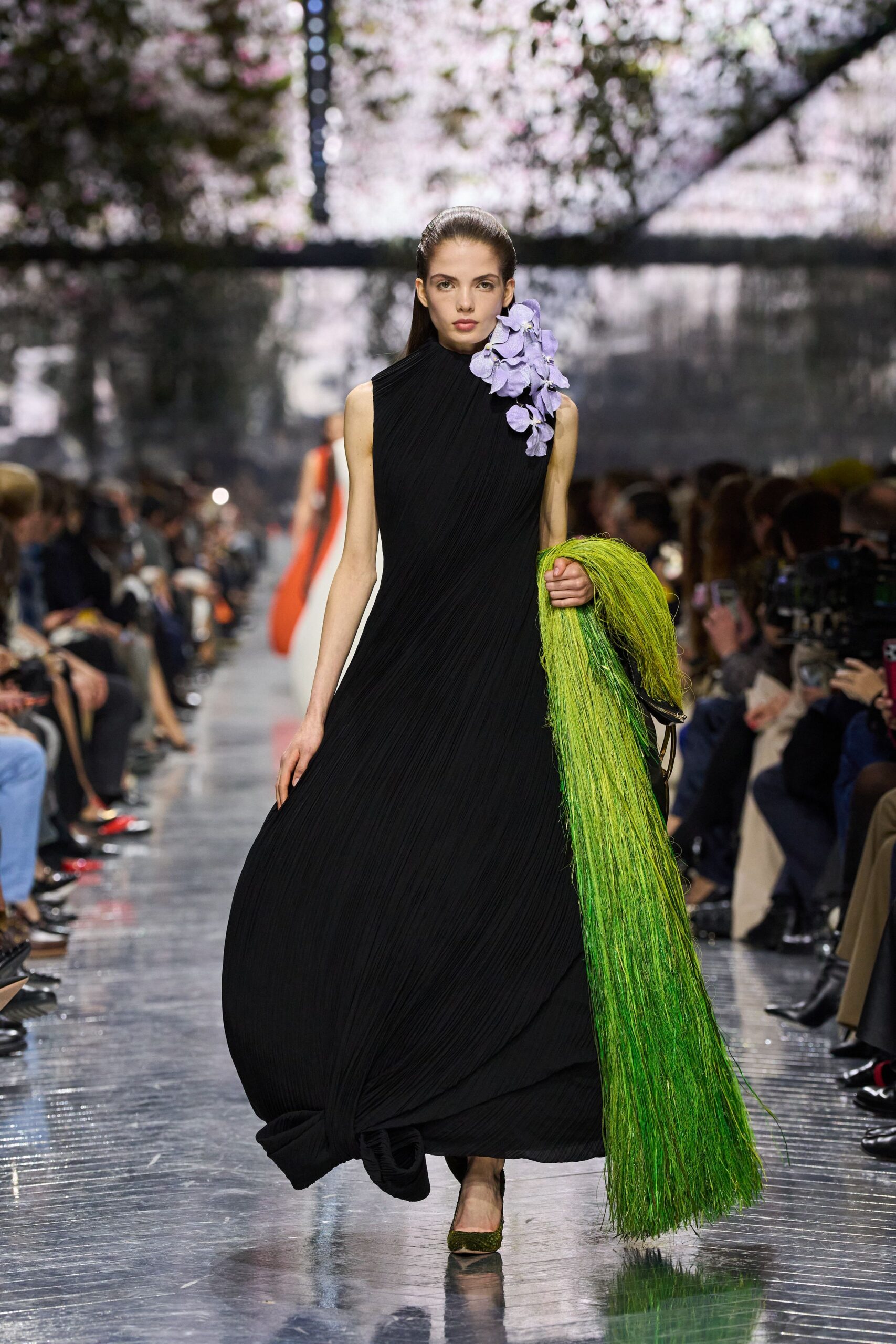 black pleated gown with green scarf