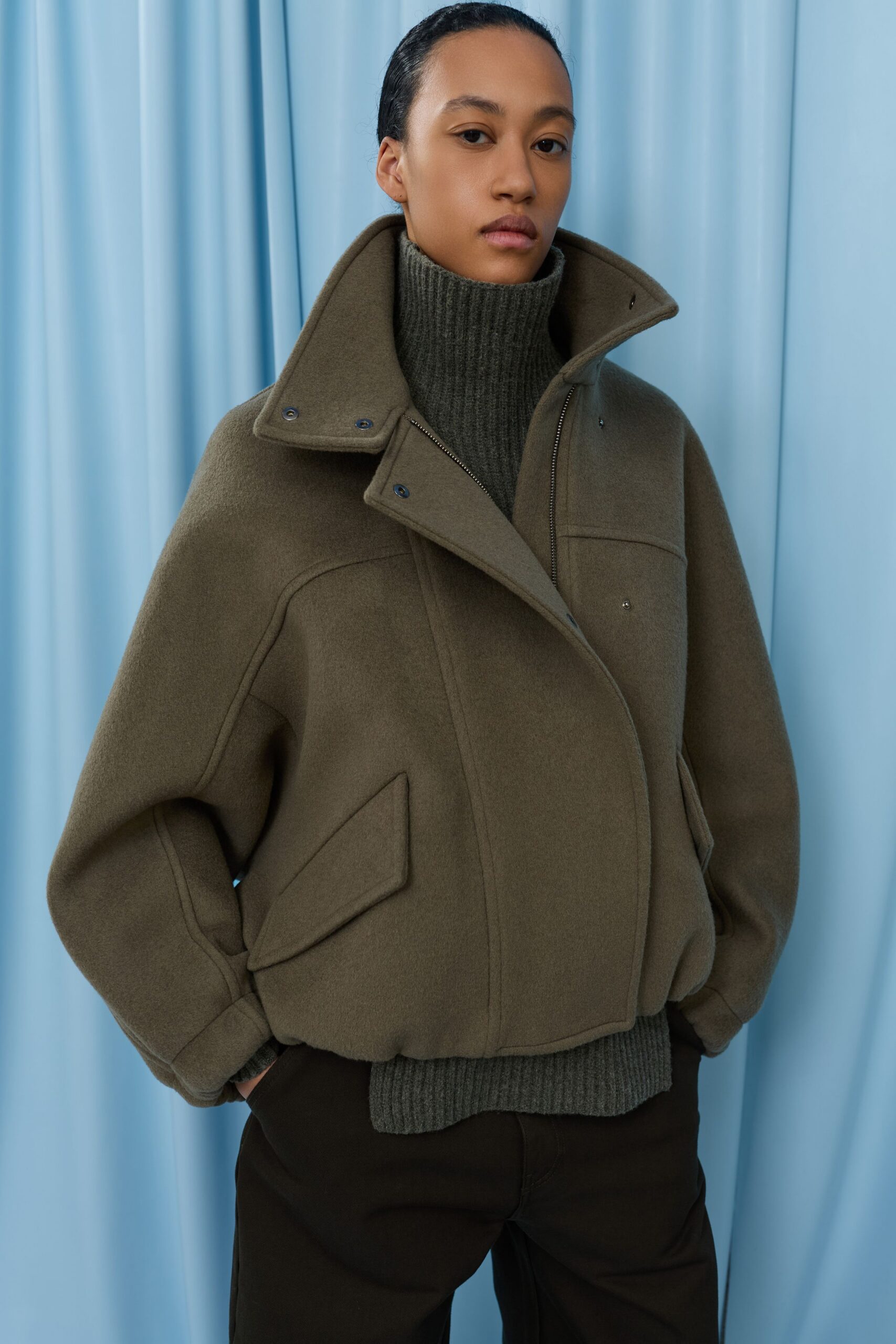 green wool long-sleeve collared oversized zippered pockets jacket