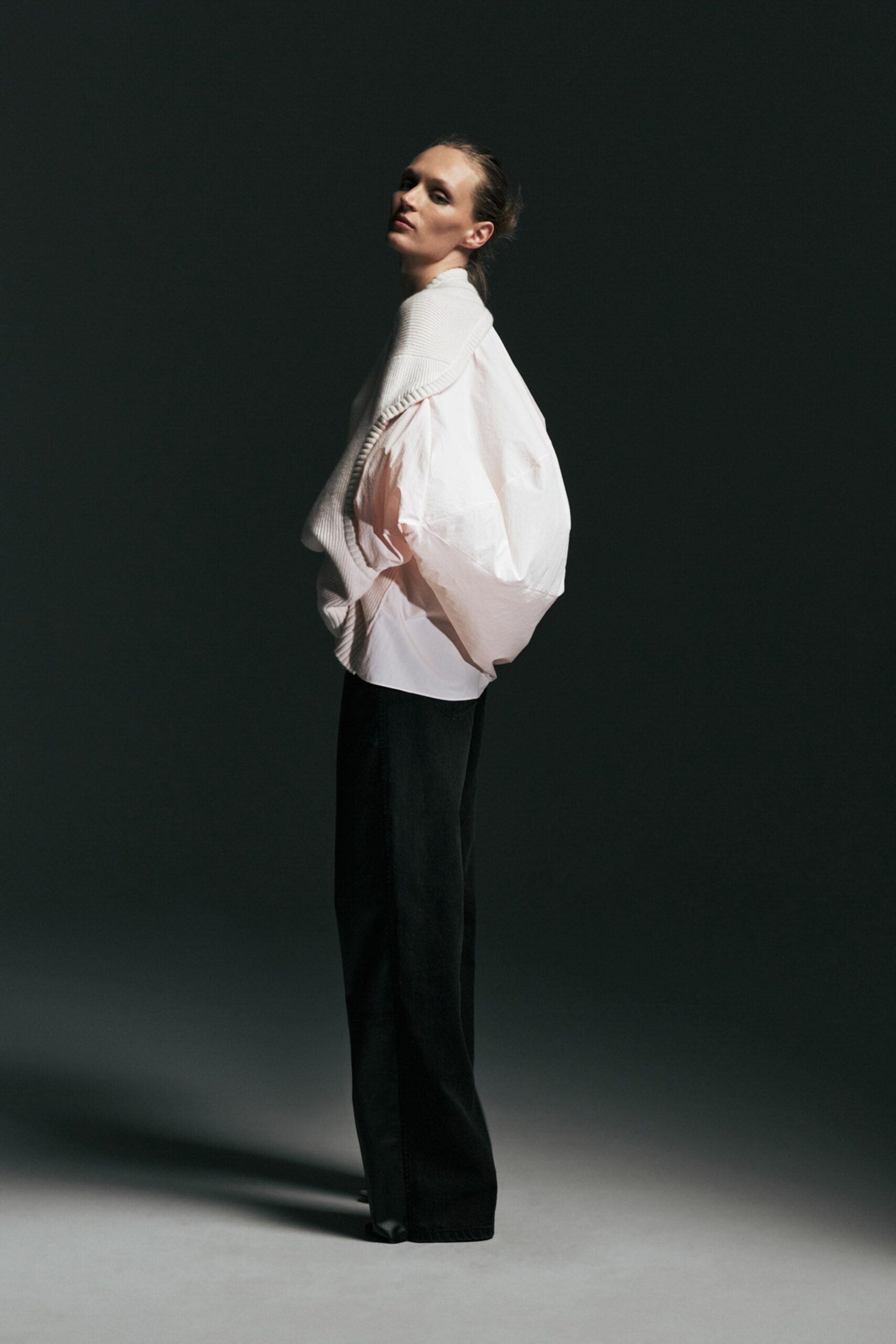 white relaxed top and black pants