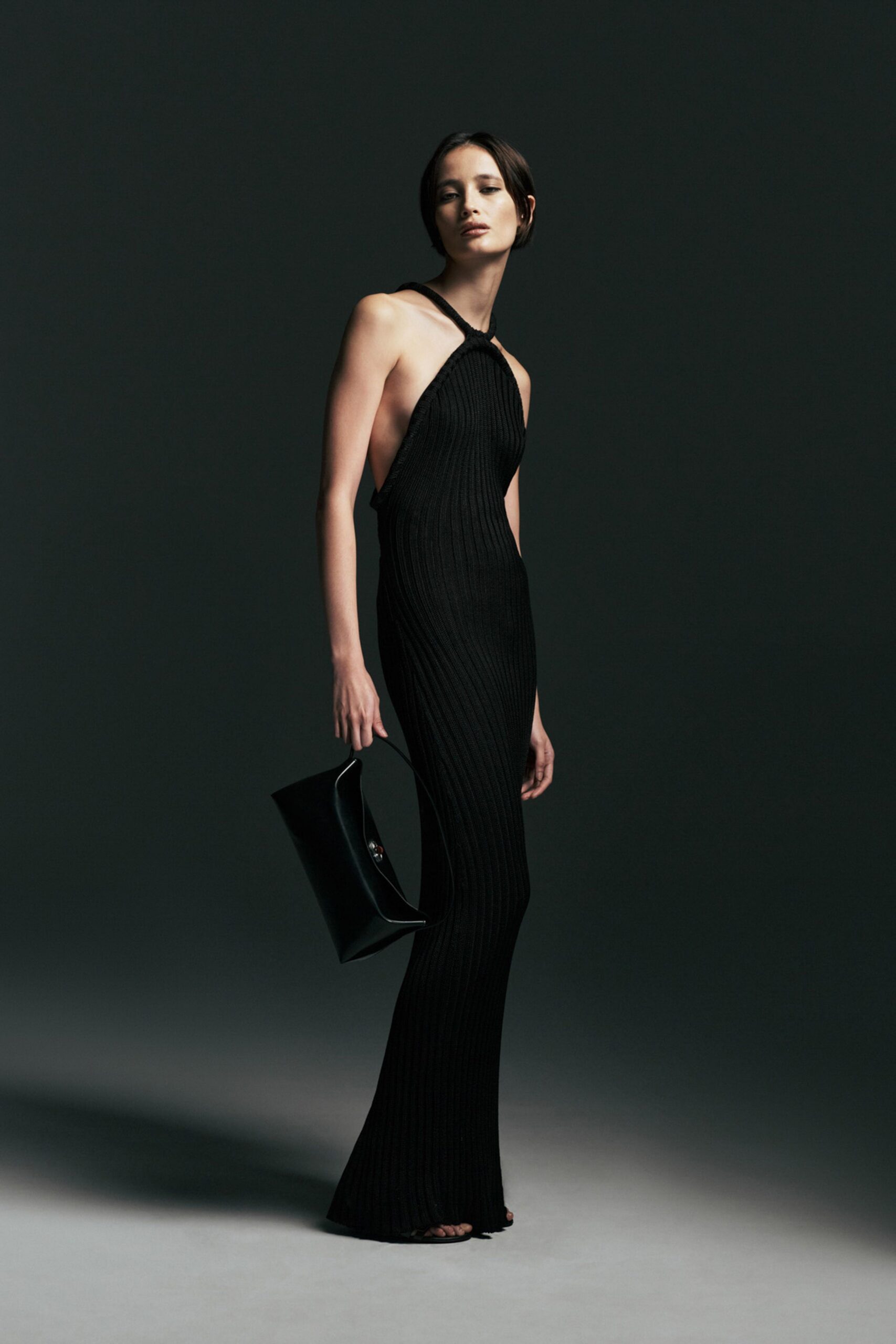 black fitted halter gown with bag