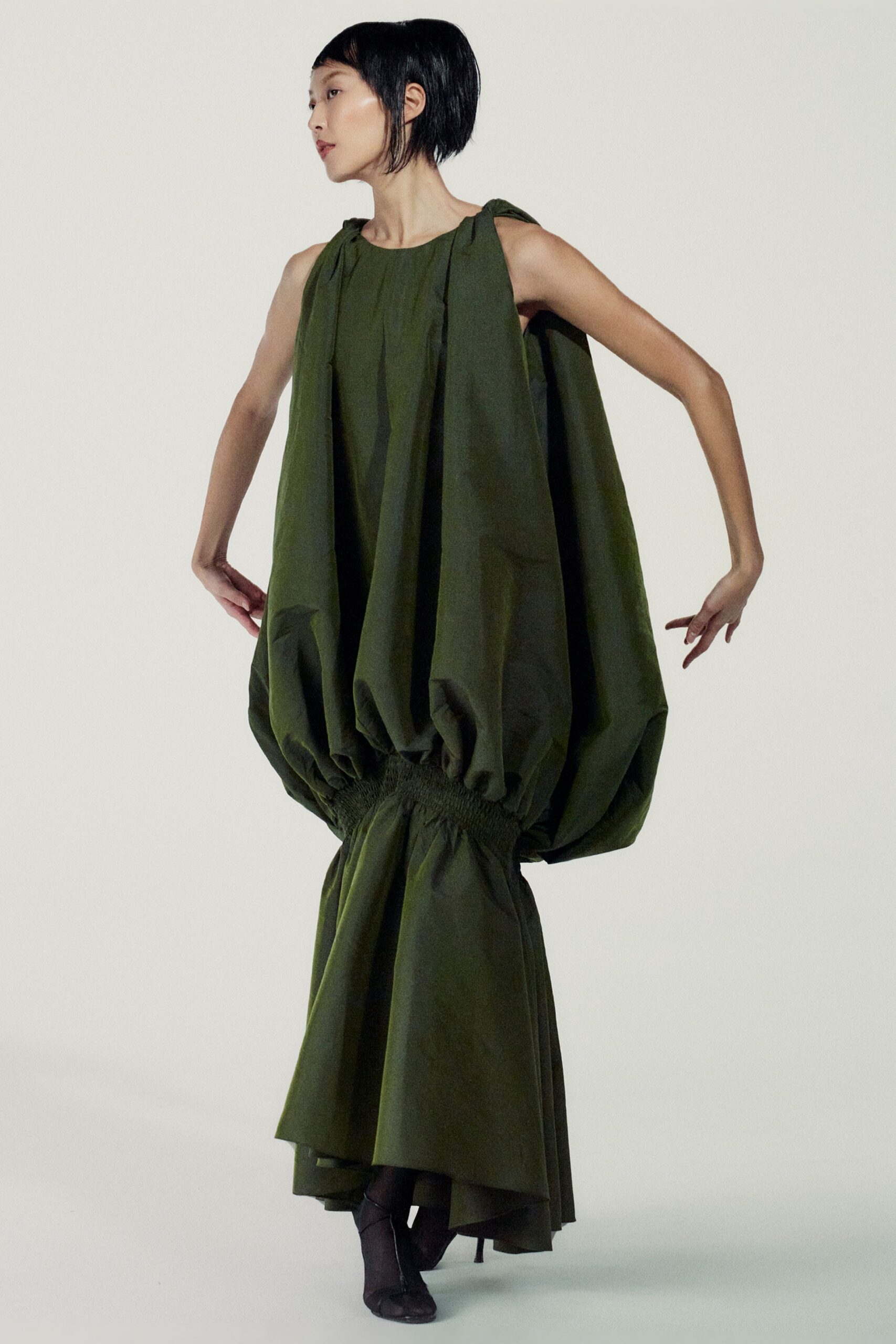 green cotton sleeveless high-neck relaxed pleated layered dress