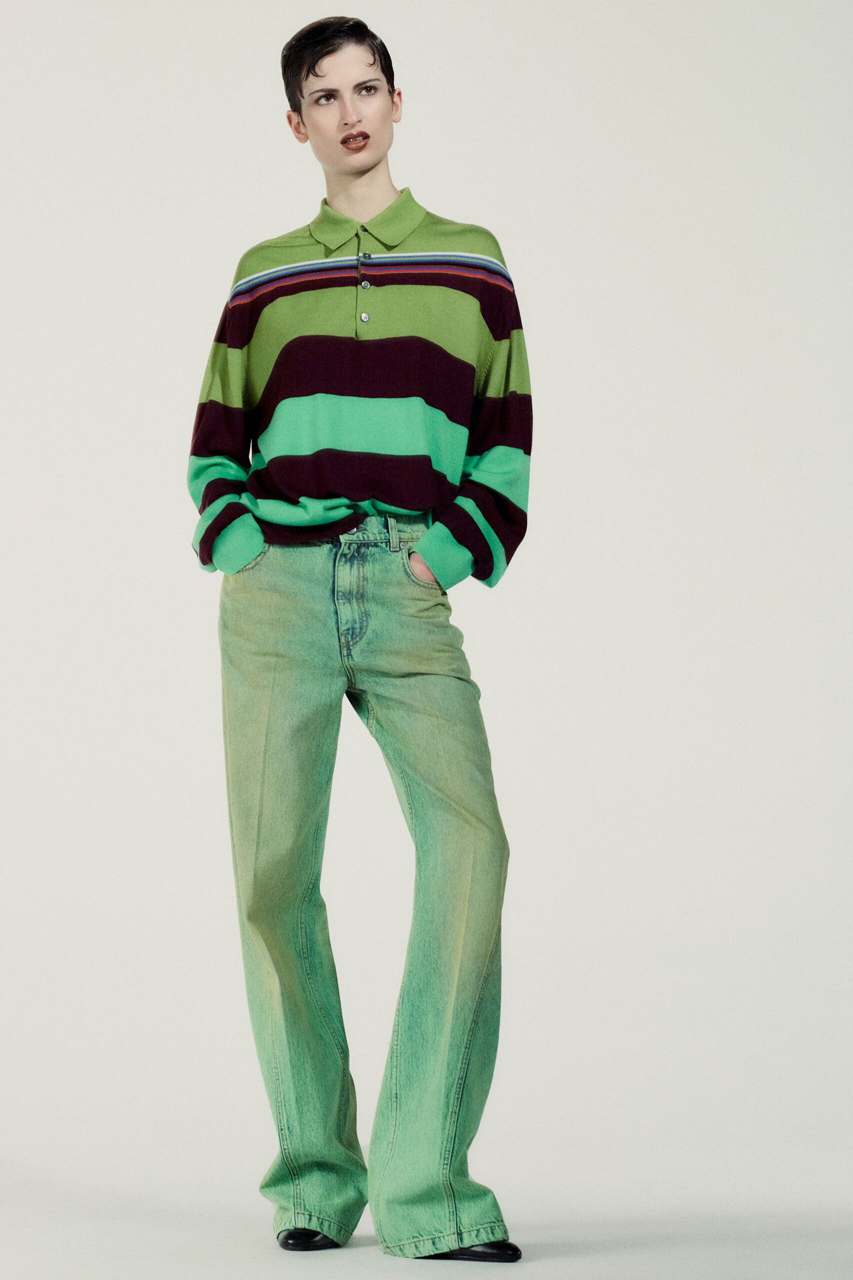 striped green and purple shirt with wide-leg jeans