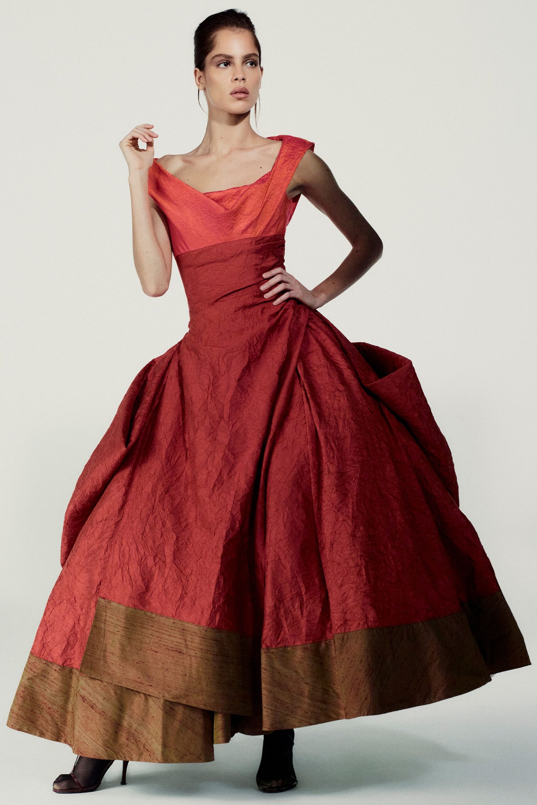 red silk sleeveless off-shoulder fitted pleated layered gown