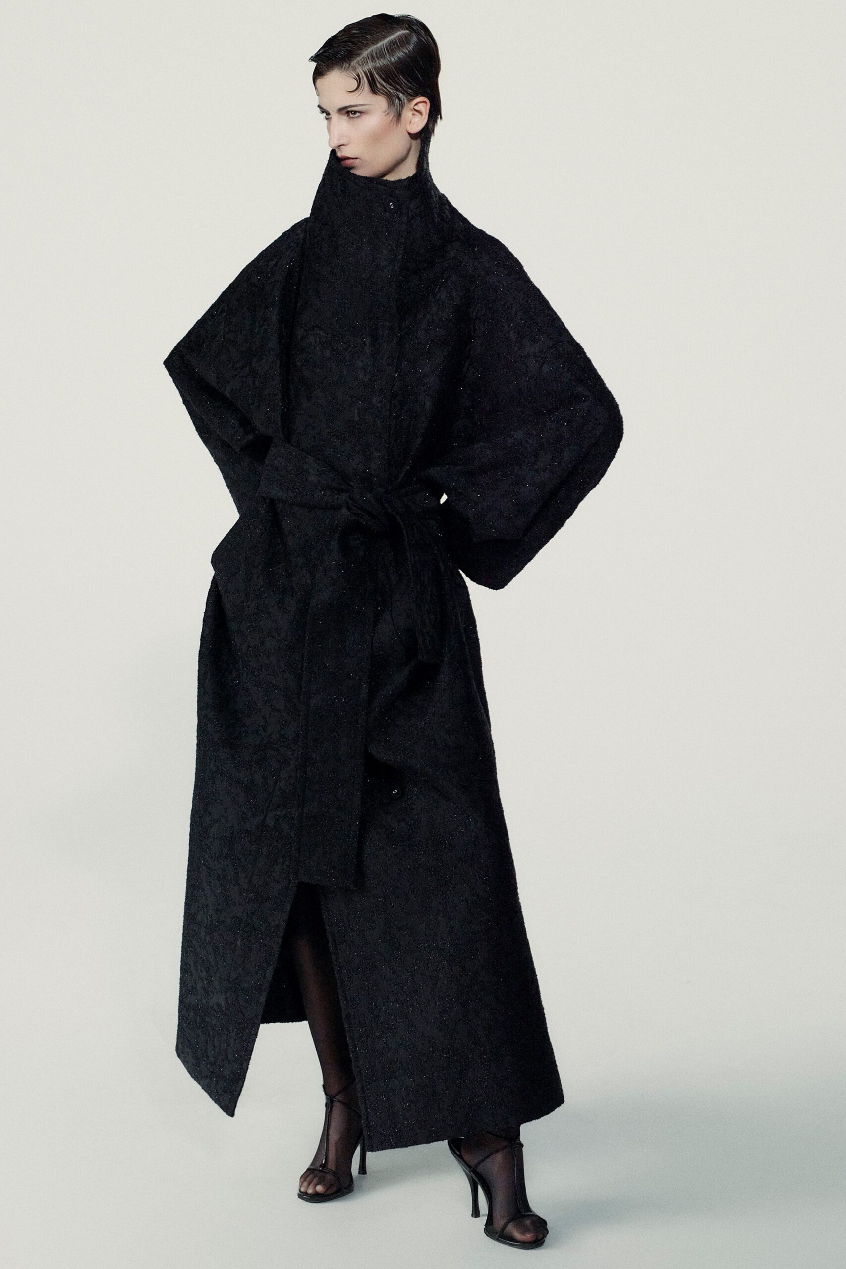 black wool long-sleeve collared relaxed belted draped coat