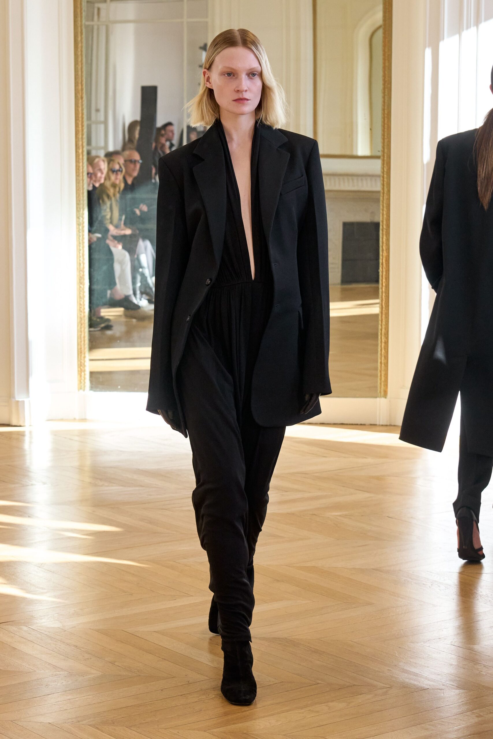 black oversized jacket and fitted jumpsuit