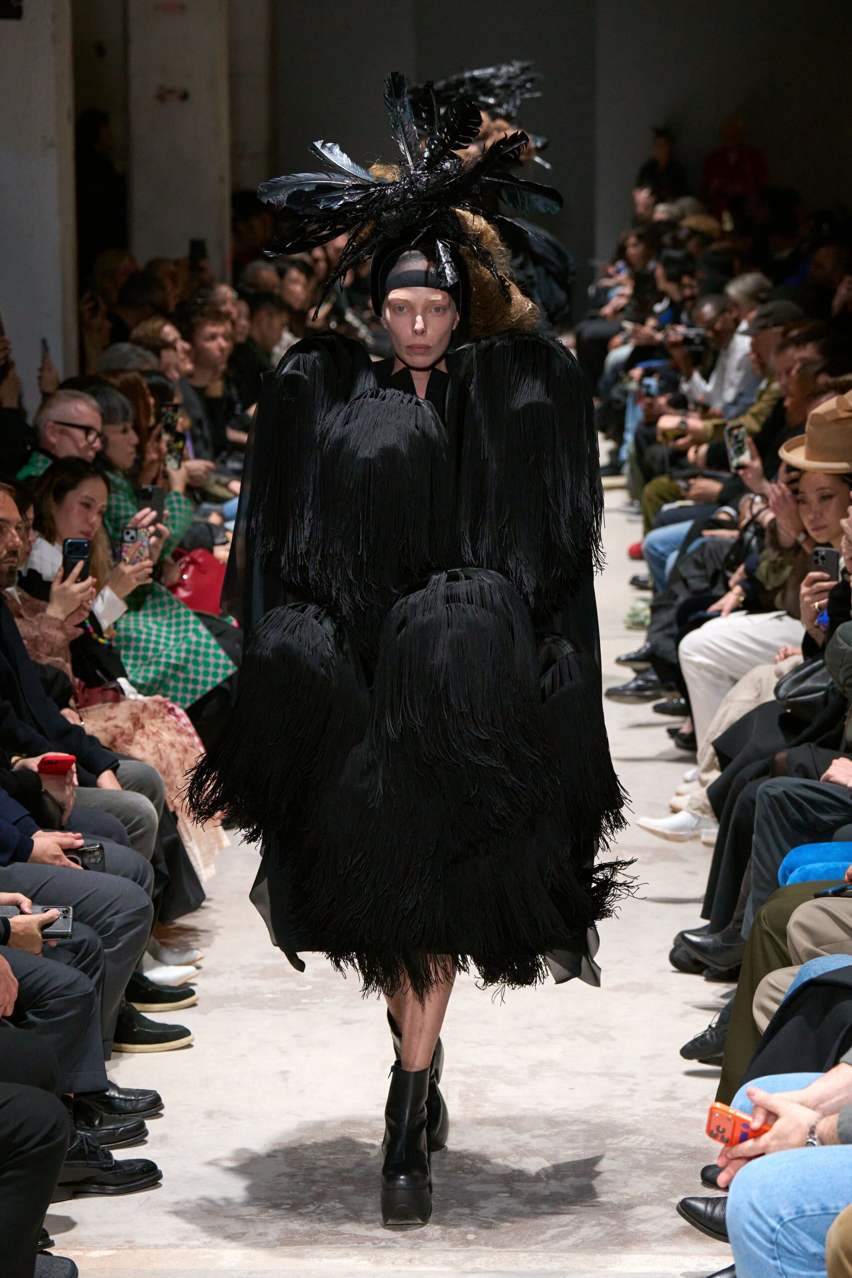 black oversized cape and fitted dress