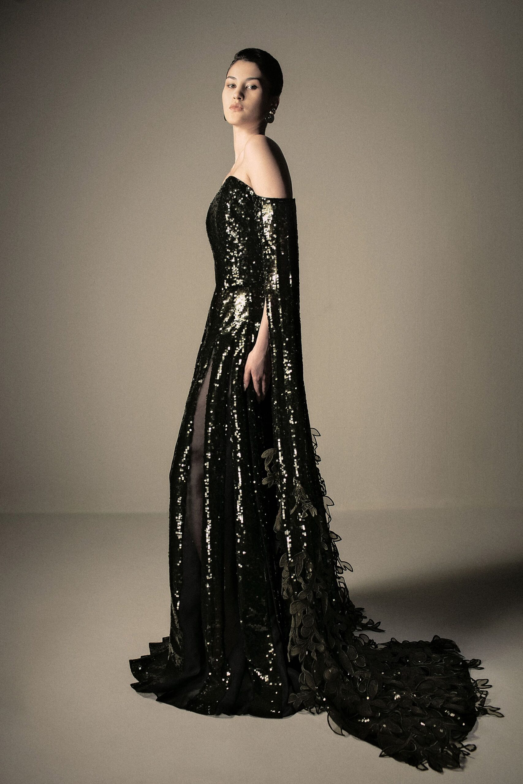 black sequin off-shoulder gown