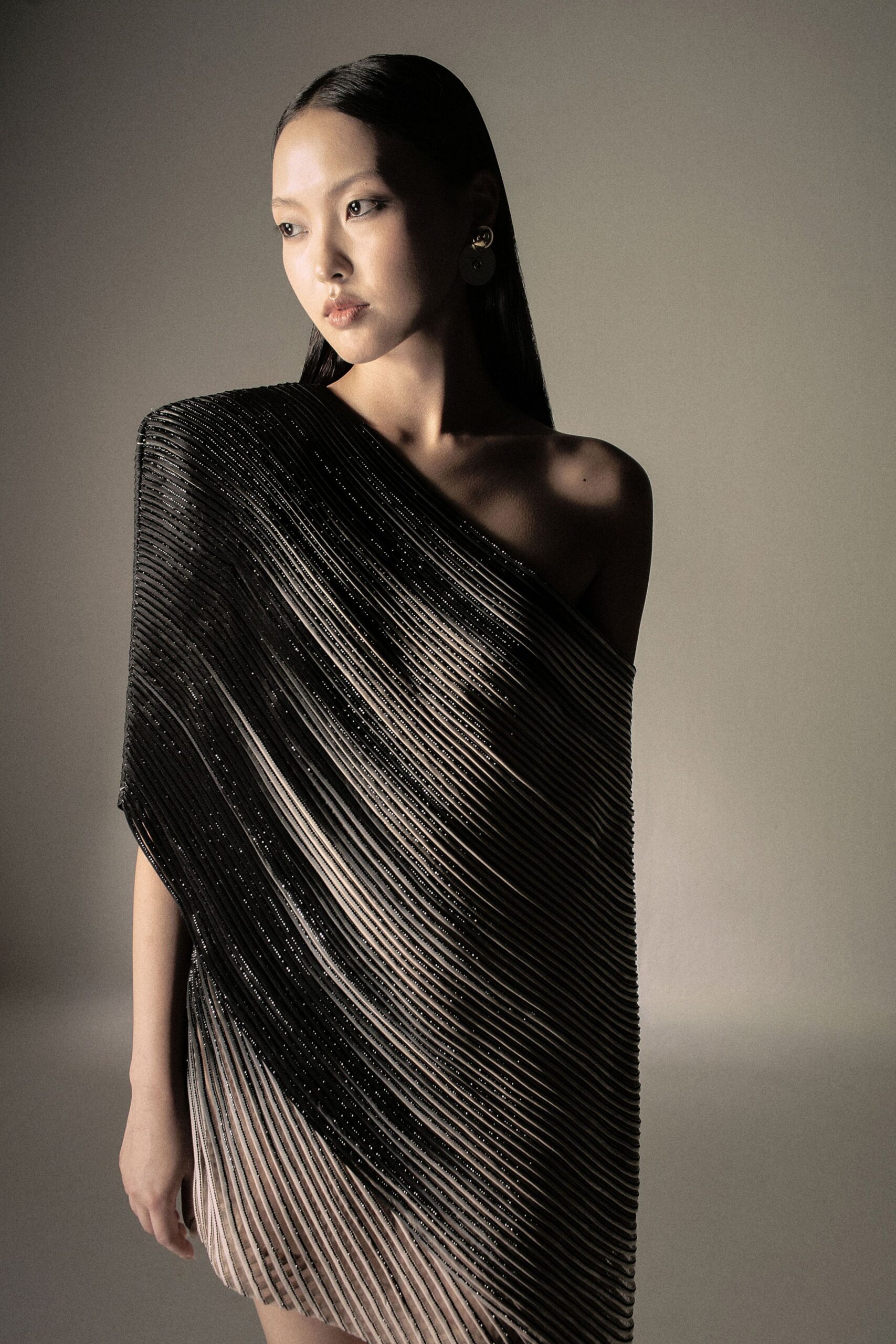 black and beige pleated dress