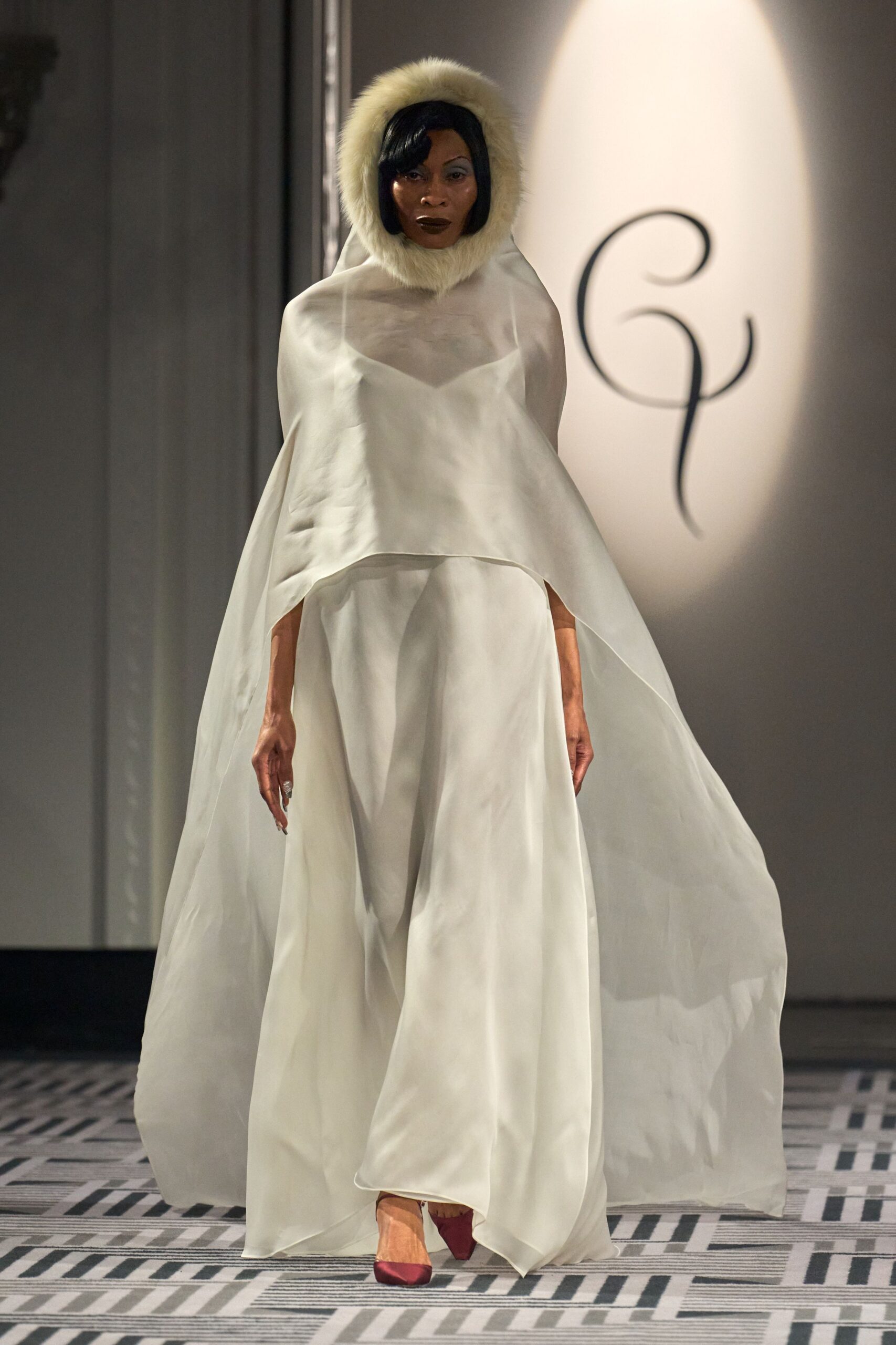 white silk sleeveless relaxed flowing cape