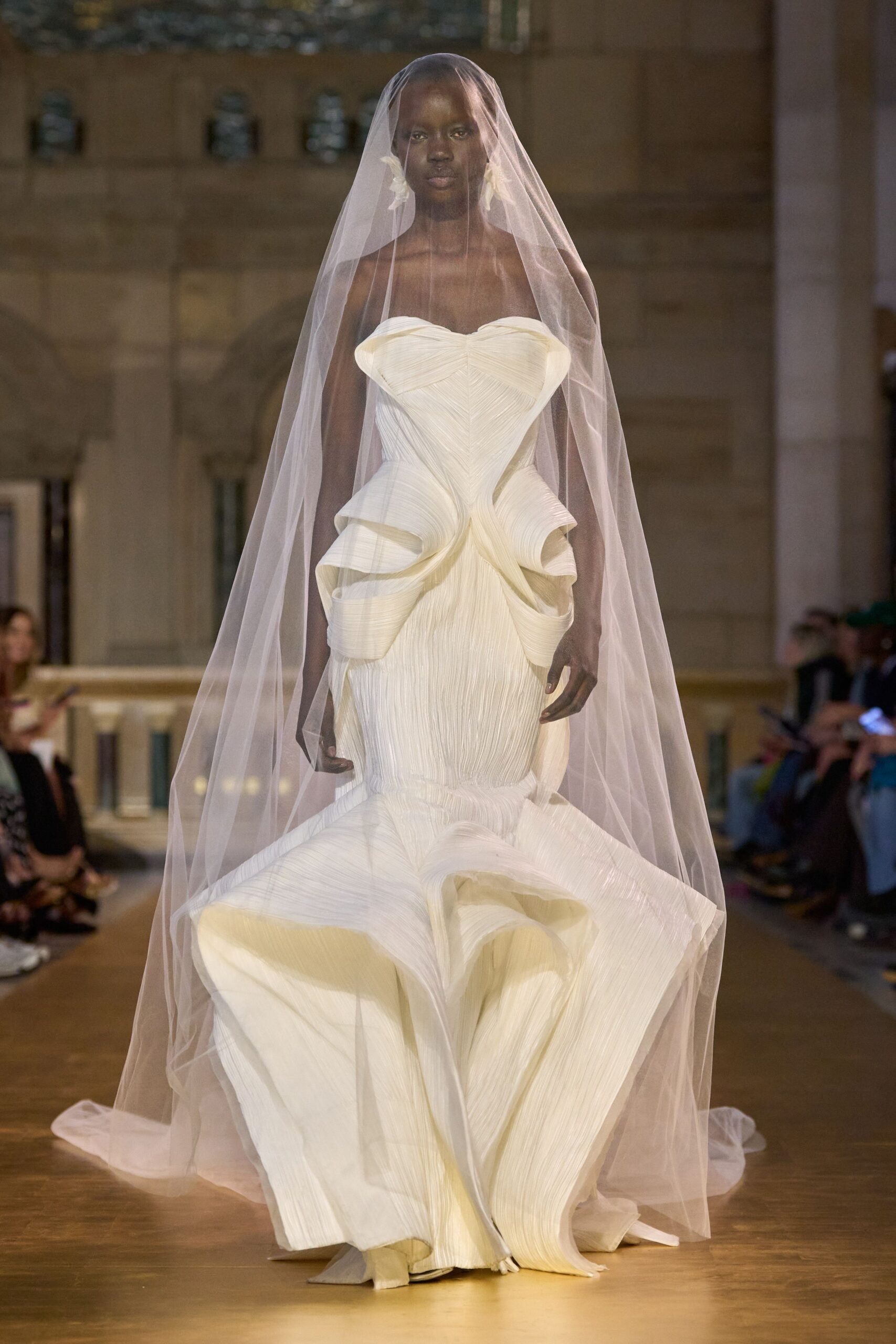 white pleated gown with veil