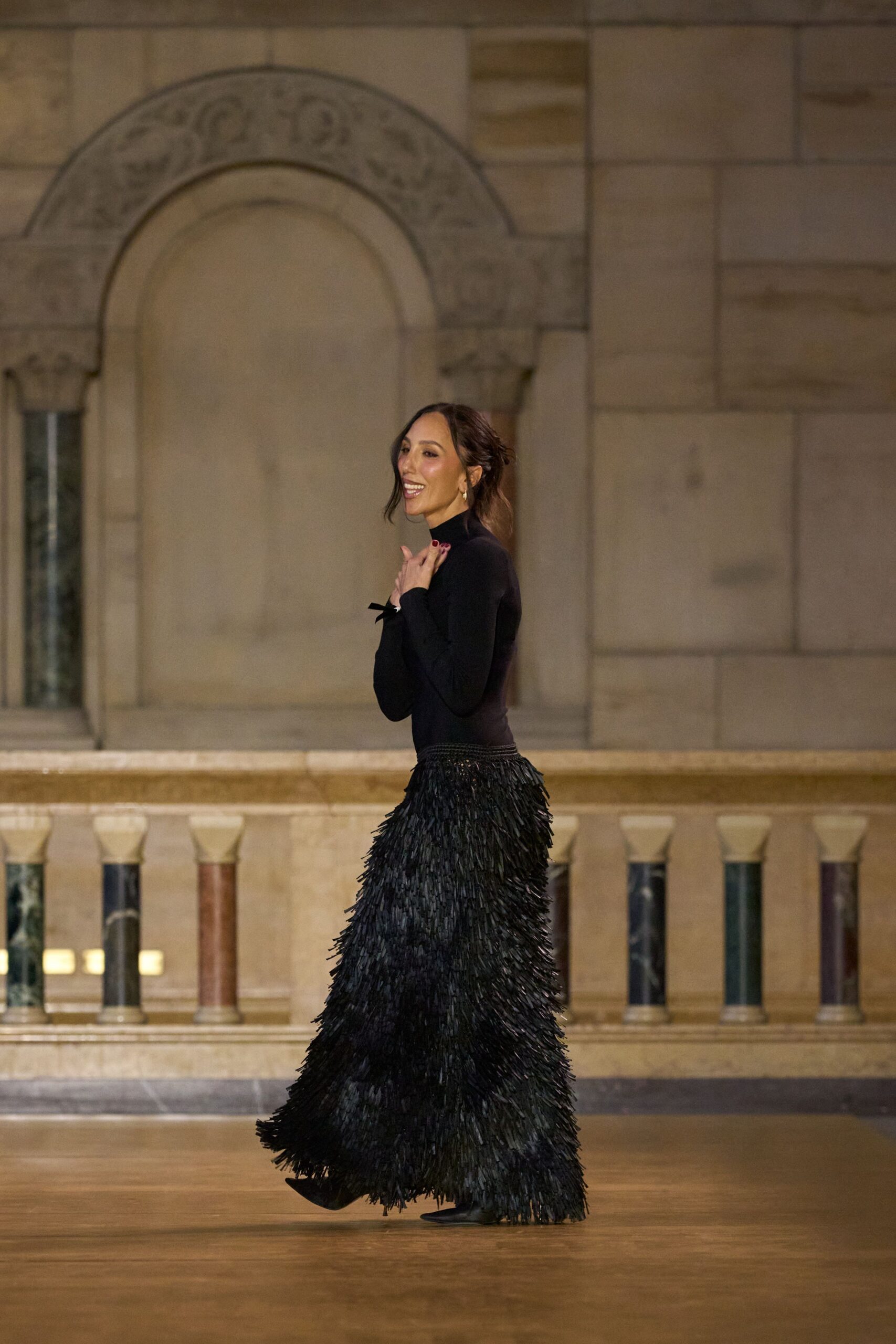 black fitted top with fringed skirt