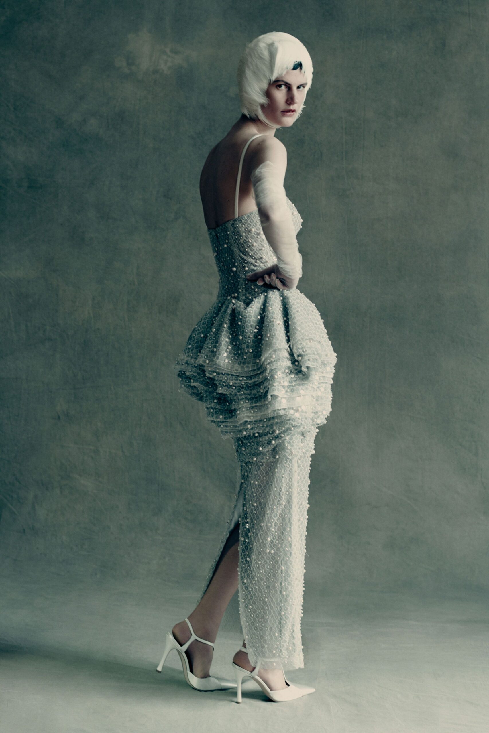 white silk sleeveless v-neck fitted ruffled embellished gown