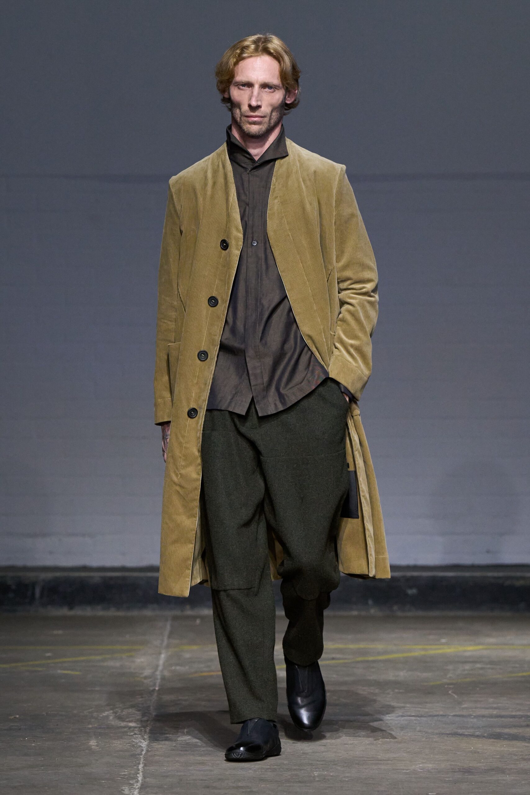 brown coat gray shirt green pants