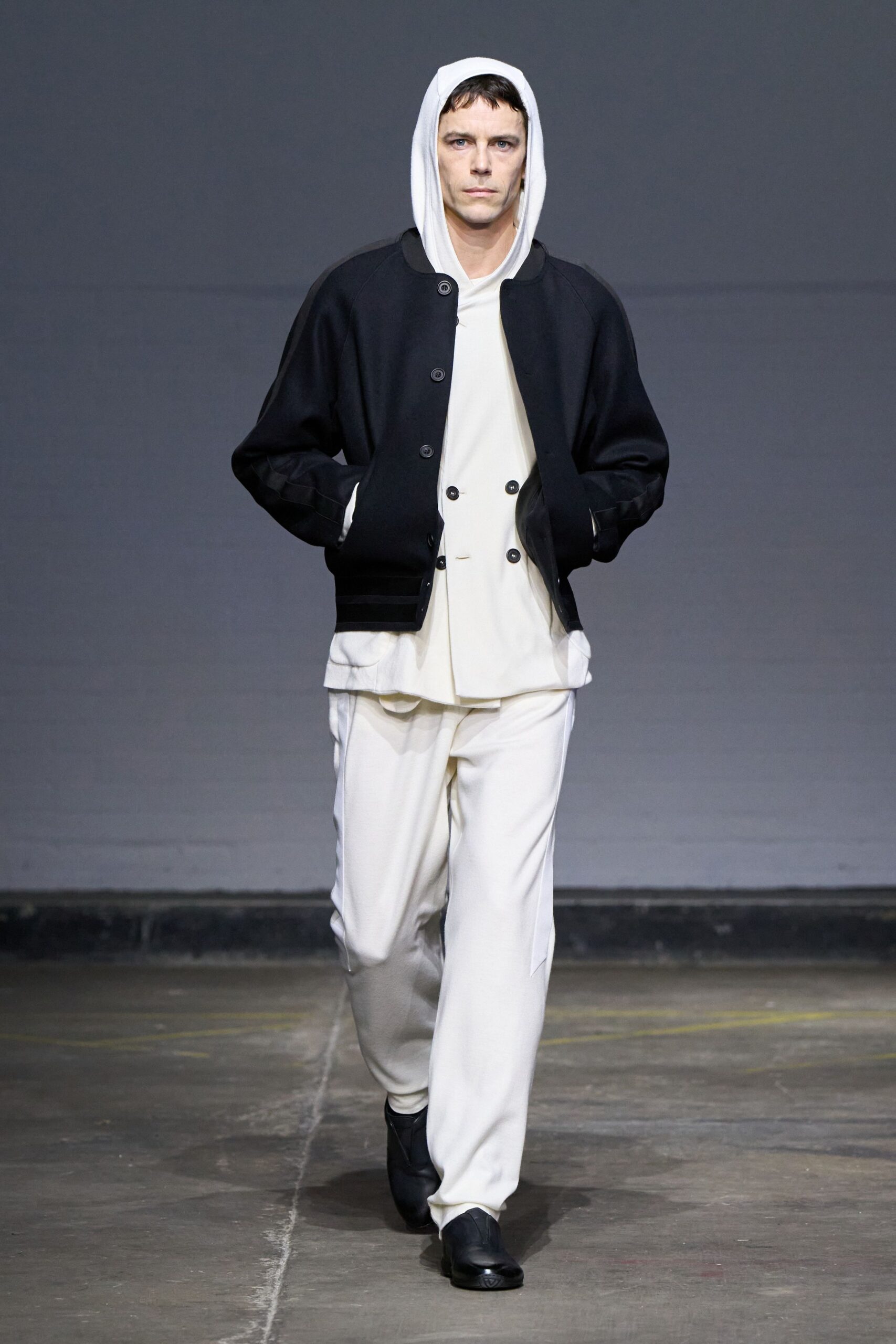 black jacket white top relaxed pants