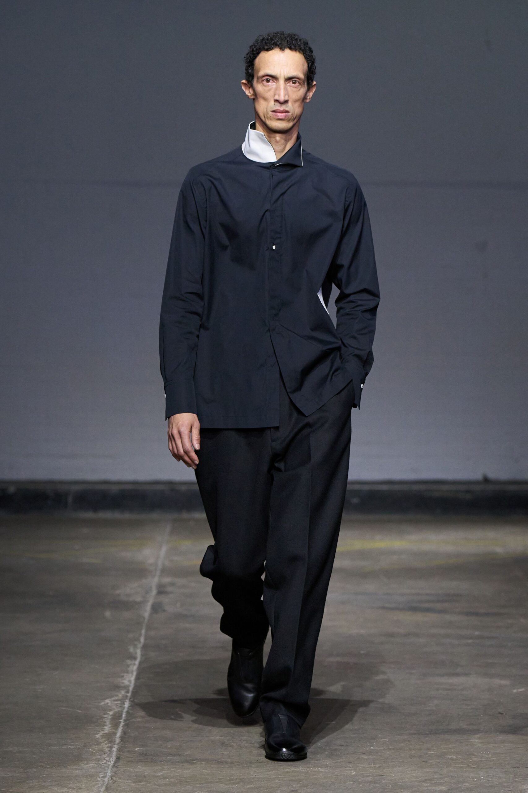 black fitted shirt and relaxed pants