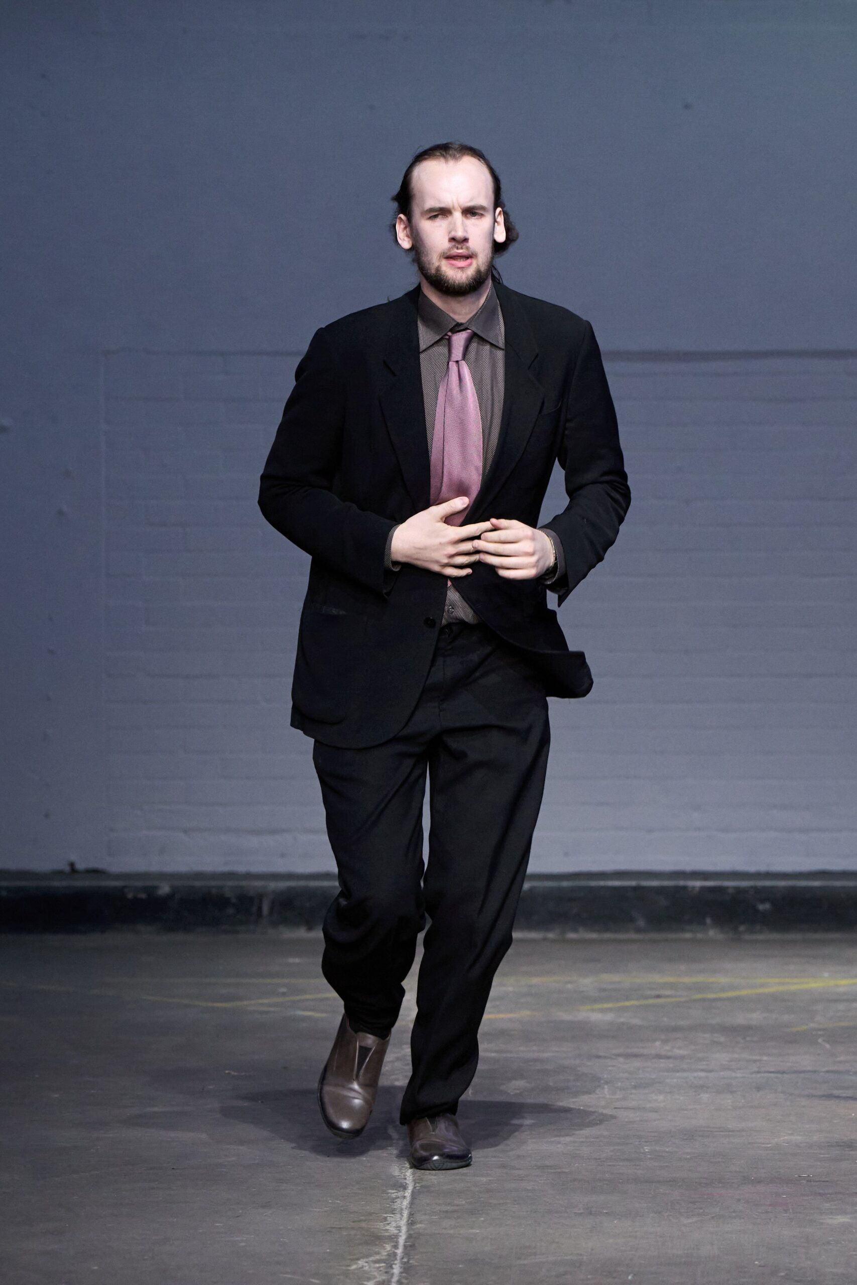 black tailored suit with brown shirt