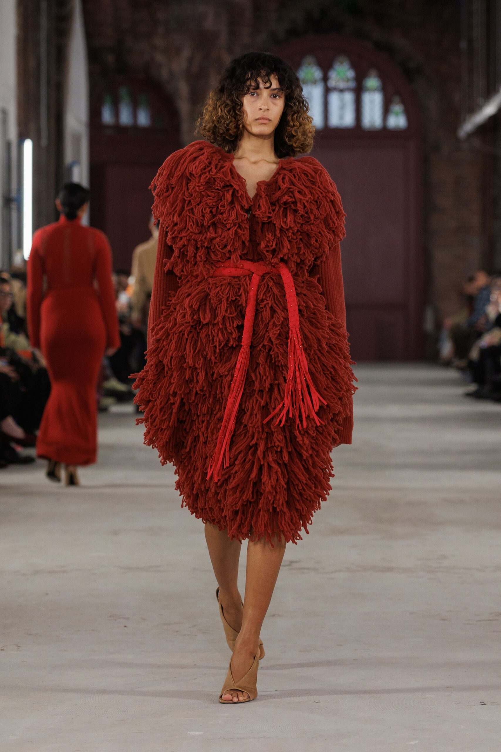 red ruffled midi dress with beige shoes