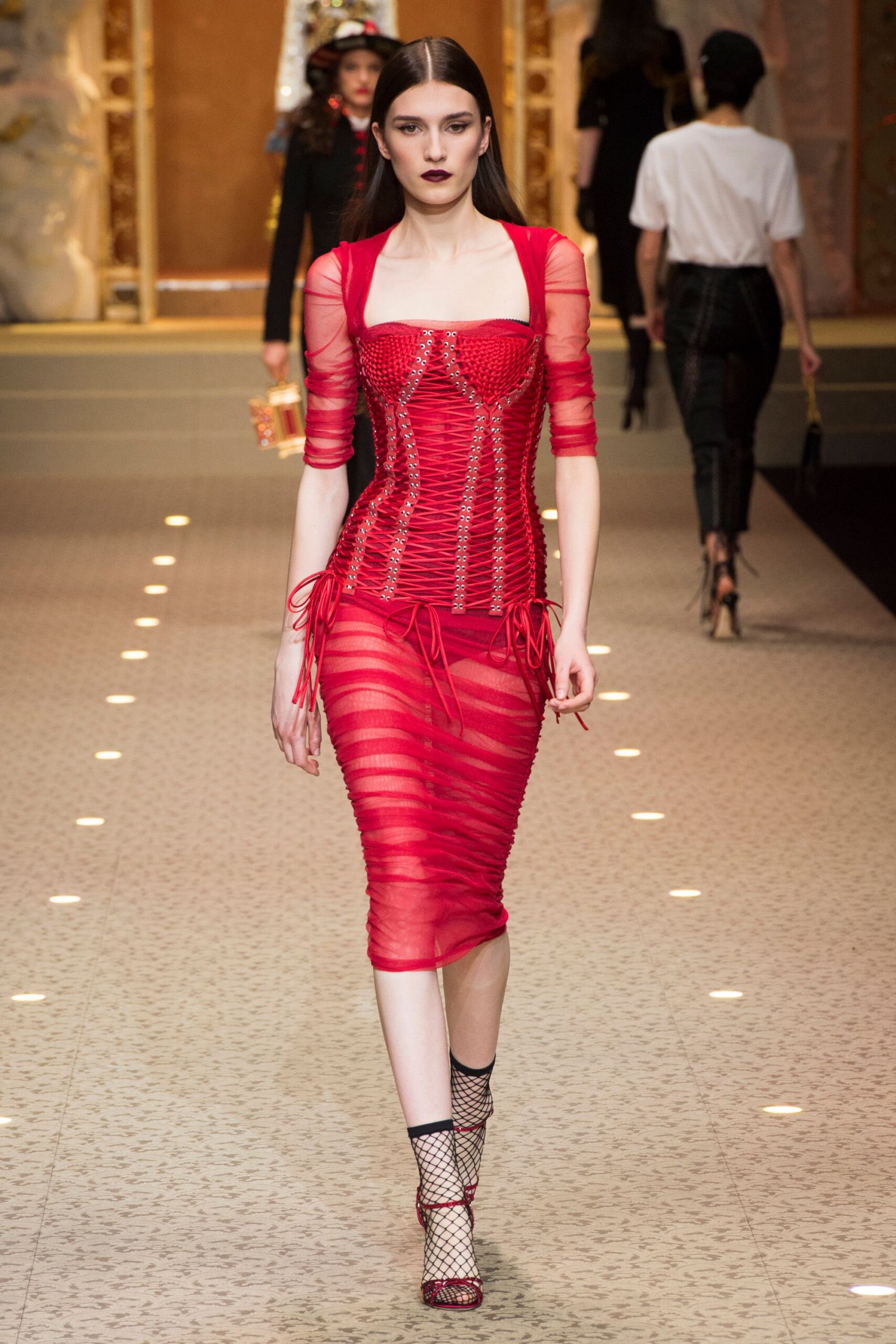 red ruched midi dress with fishnet shoes