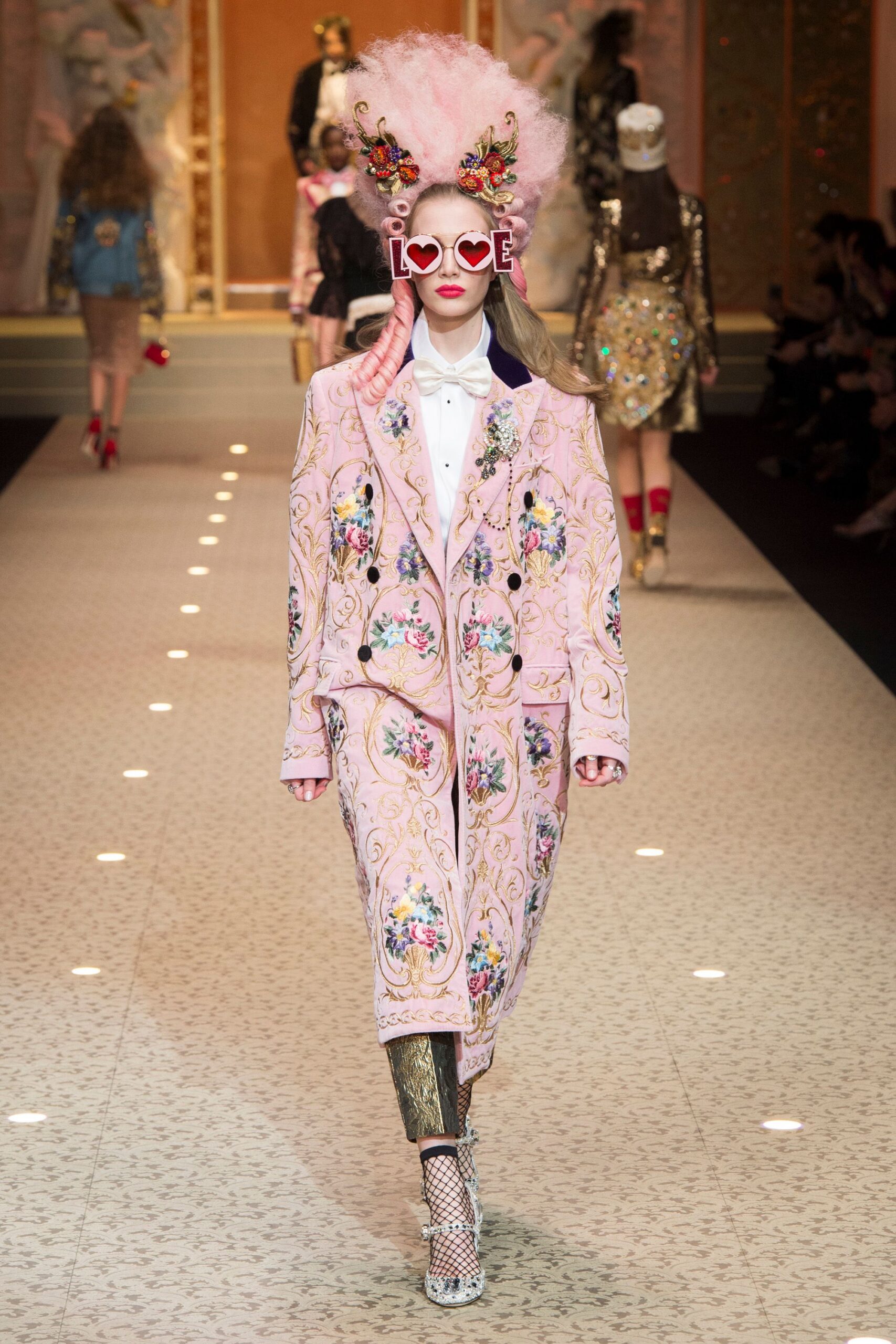 pink embroidered coat with gold pants