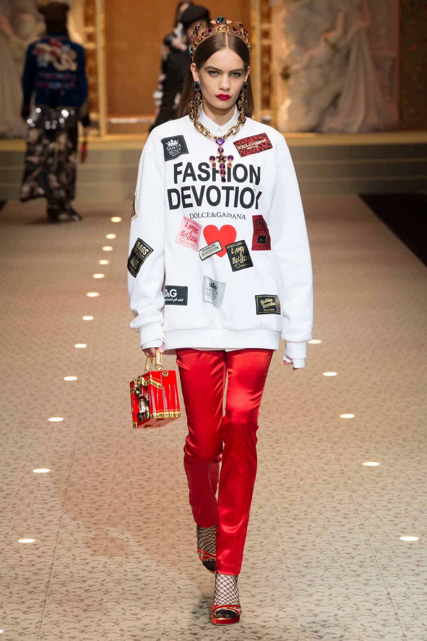 oversized white sweater with red pants