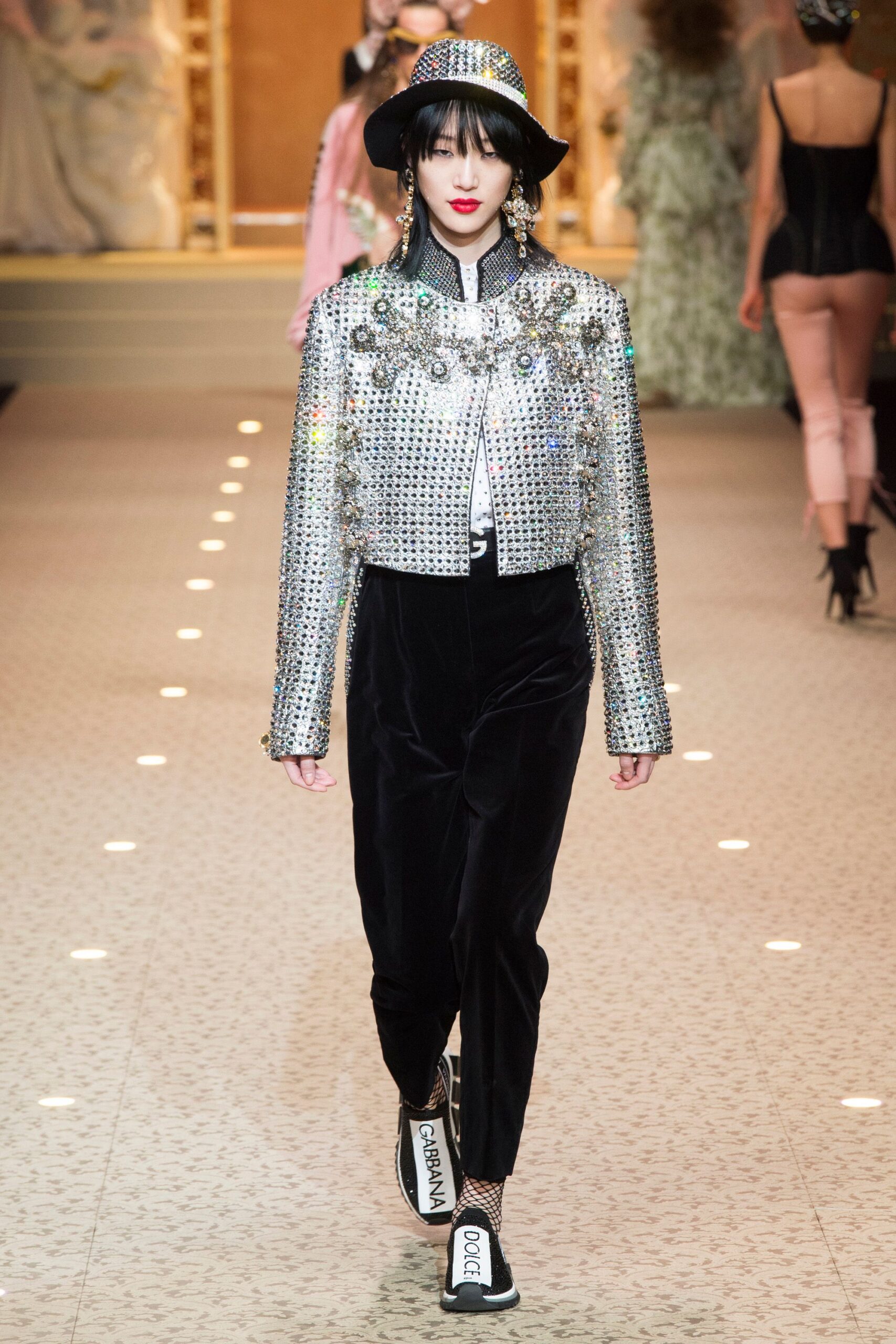 silver embellished jacket with black pants