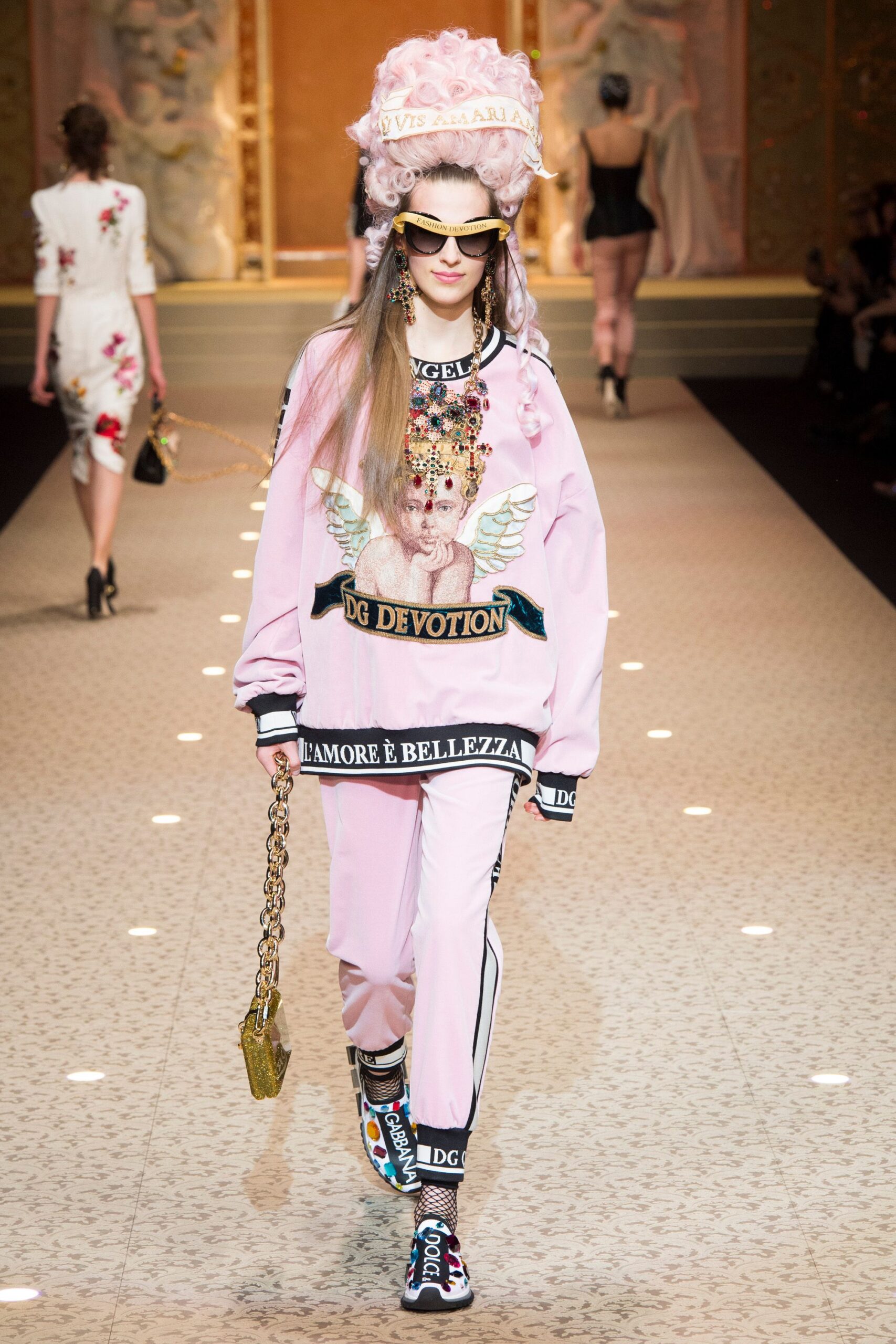pink relaxed sweater with striped pants