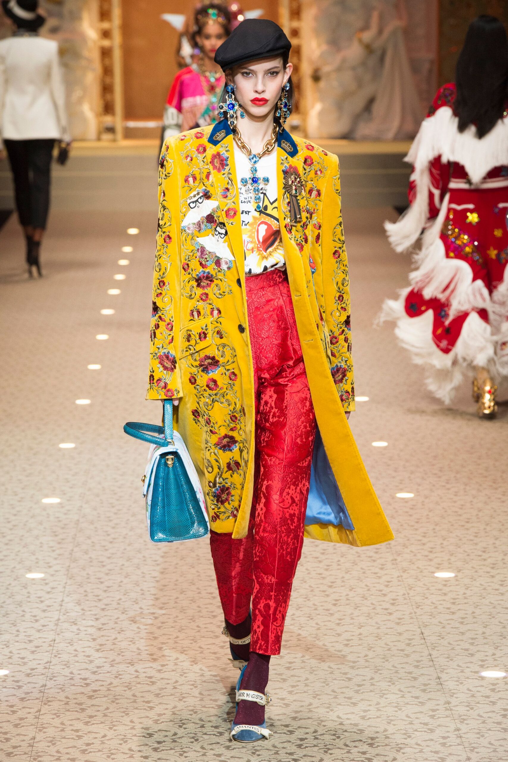 yellow embroidered coat with red pants